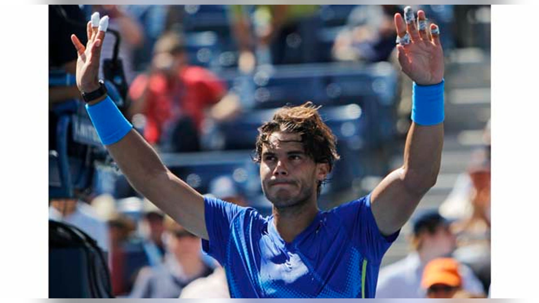 Rafael Nadal of Spain reacts after winning his match against Gilles Muller of Luxembourg during the U.S. Open tennis tournament in New York, Thursday, Sept. 8, 2011. (AP Photo/Mike Groll)
