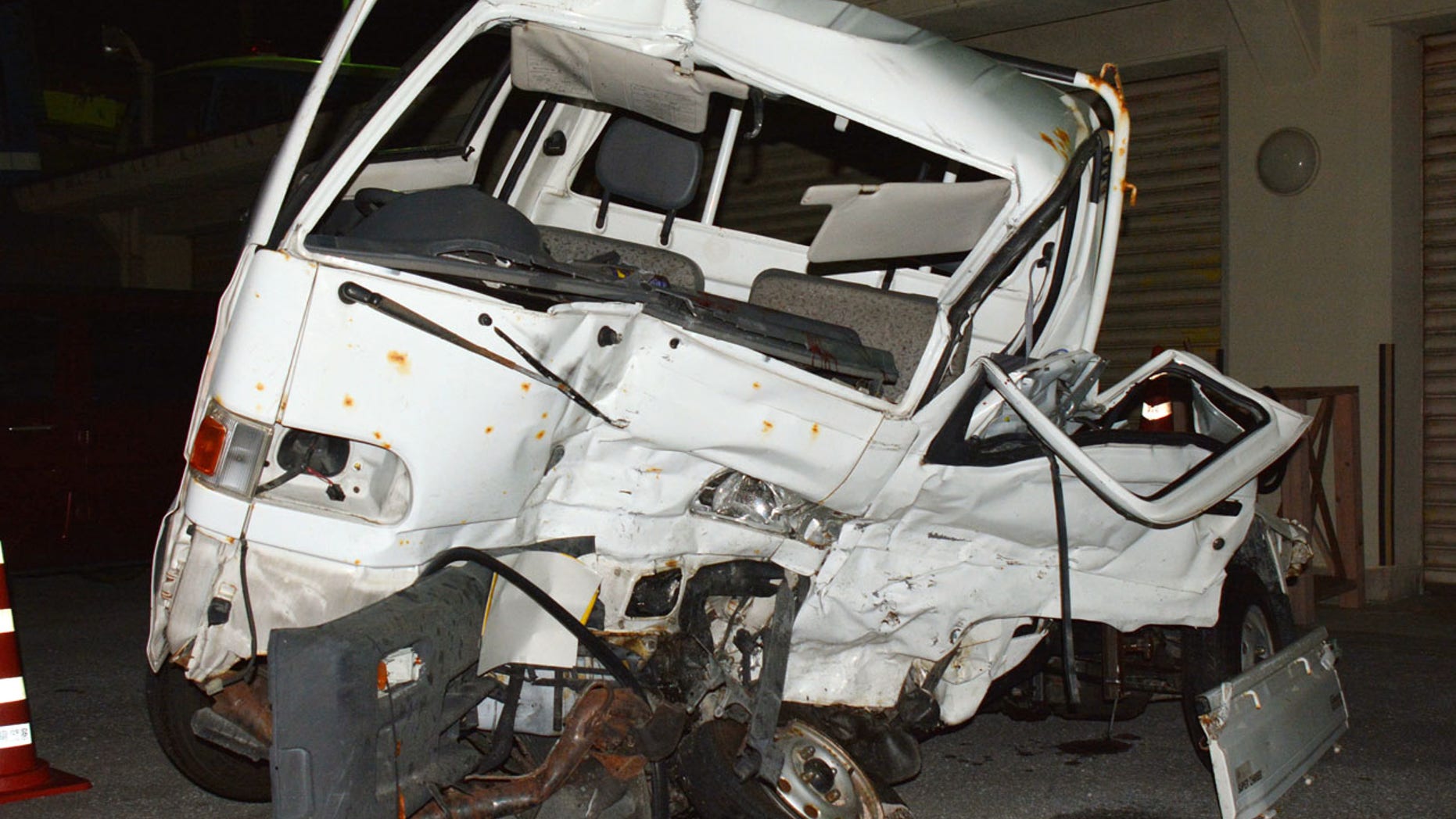 Nov. 19: A Japanese driver's damaged vehicle is placed at a police station in Naha, Okinawa.
