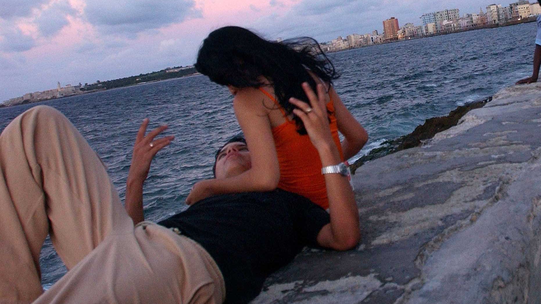 HAVANA, CUBA - A couple on the Malecon waterfront.. (Photo by Spencer Platt/Getty Images)