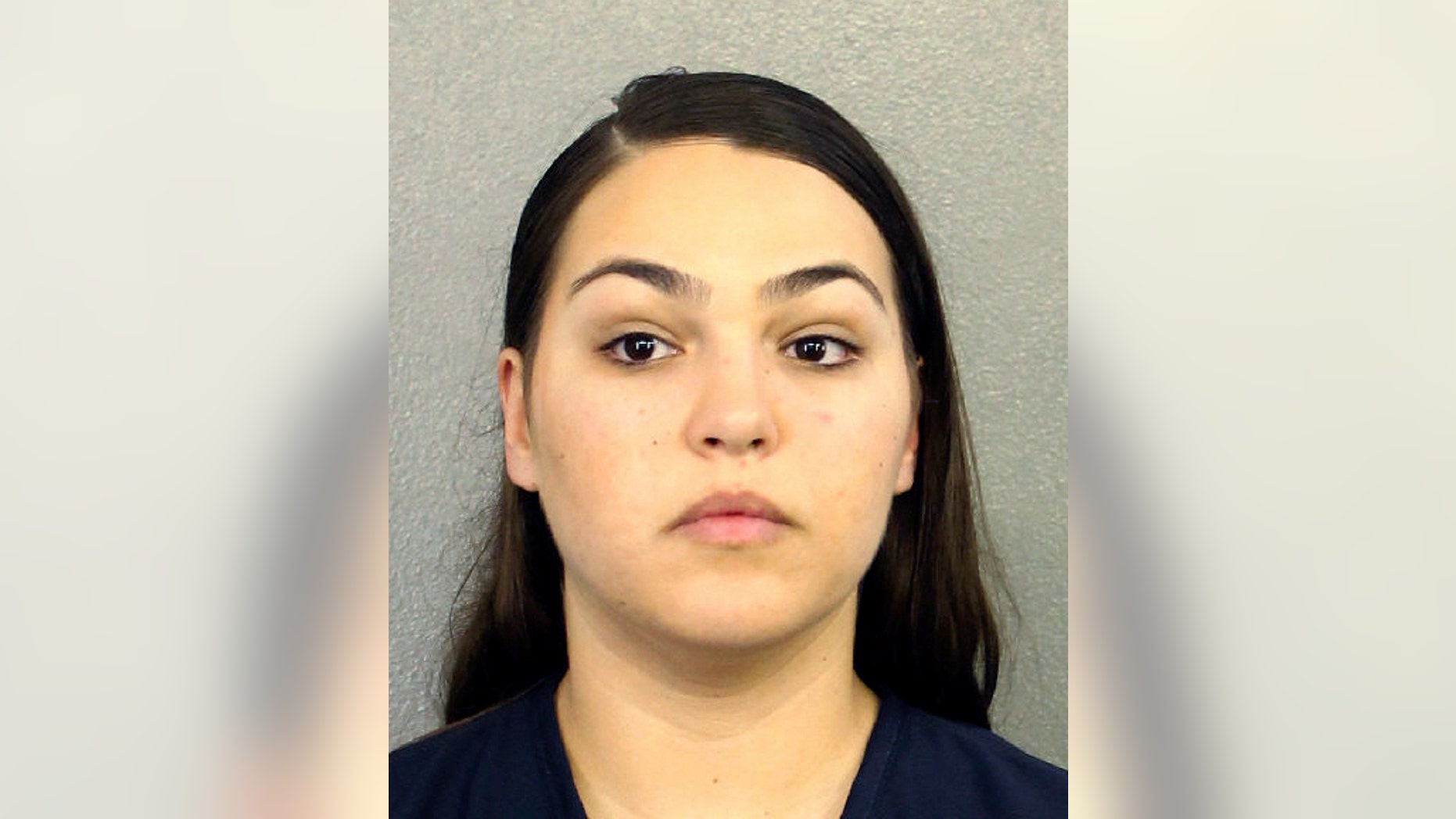 This Wednesday, Feb. 22, 2017 booking photo released by the Broward County Sheriff's Office shows Ana Lucia Gnecco in Fort Lauderdale, Fla. Gnecco, a U.S. Navy sailor, is accused of deserting her post after having a baby in August. (Broward County Sheriff's Office via AP)