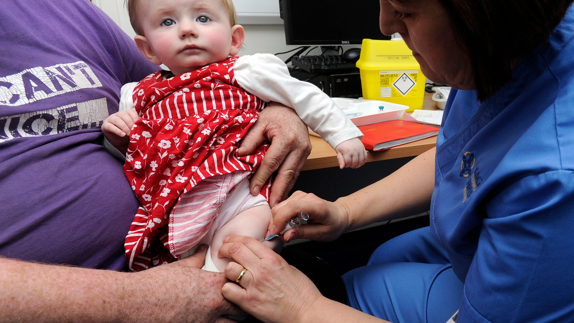 A 10-month-old receives an MMR injection. (REUTERS/Rebecca Naden)