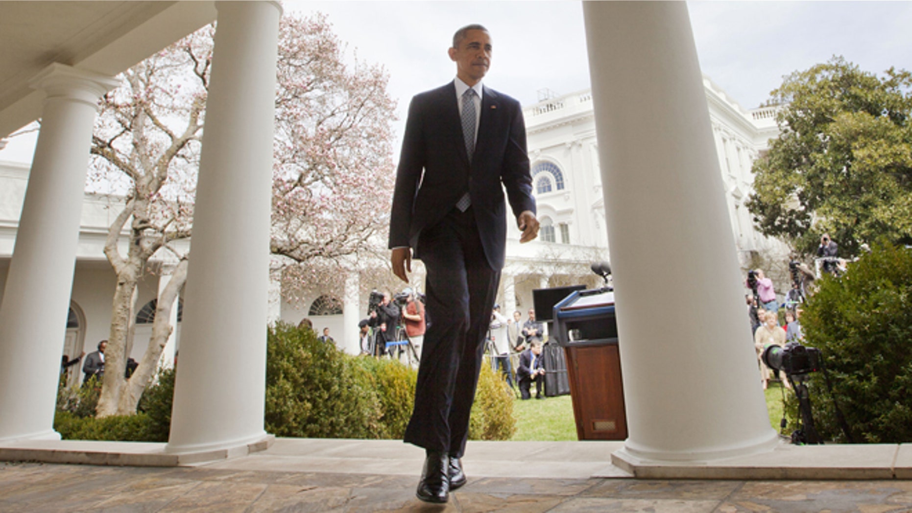 April 2, 2015: President Obama walks back to Oval Office from the Rose Garden of the White House in Washington.