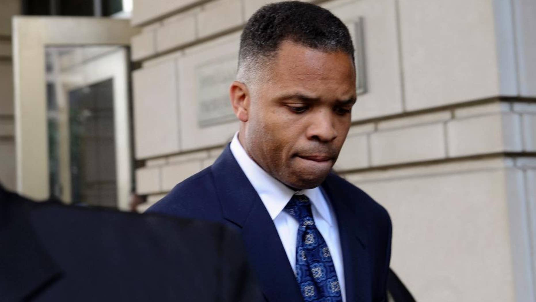 FILE - In this Aug. 14, 2013, file photo, former Illinois Rep. Jesse Jackson Jr., leaves federal court in Washington after being sentenced to 2 1/2 years in prison for misusing $750,000 in campaign funds. Jackson Jr. will be released from a federal prison on Thursday, March 26, 2015, and will serve out the remainder of his term in a Washington, D.C., halfway house, former U.S. Rep. Patrick Kennedy told The Associated Press after visiting Jackson behind bars. (AP Photo/Susan Walsh, File)
