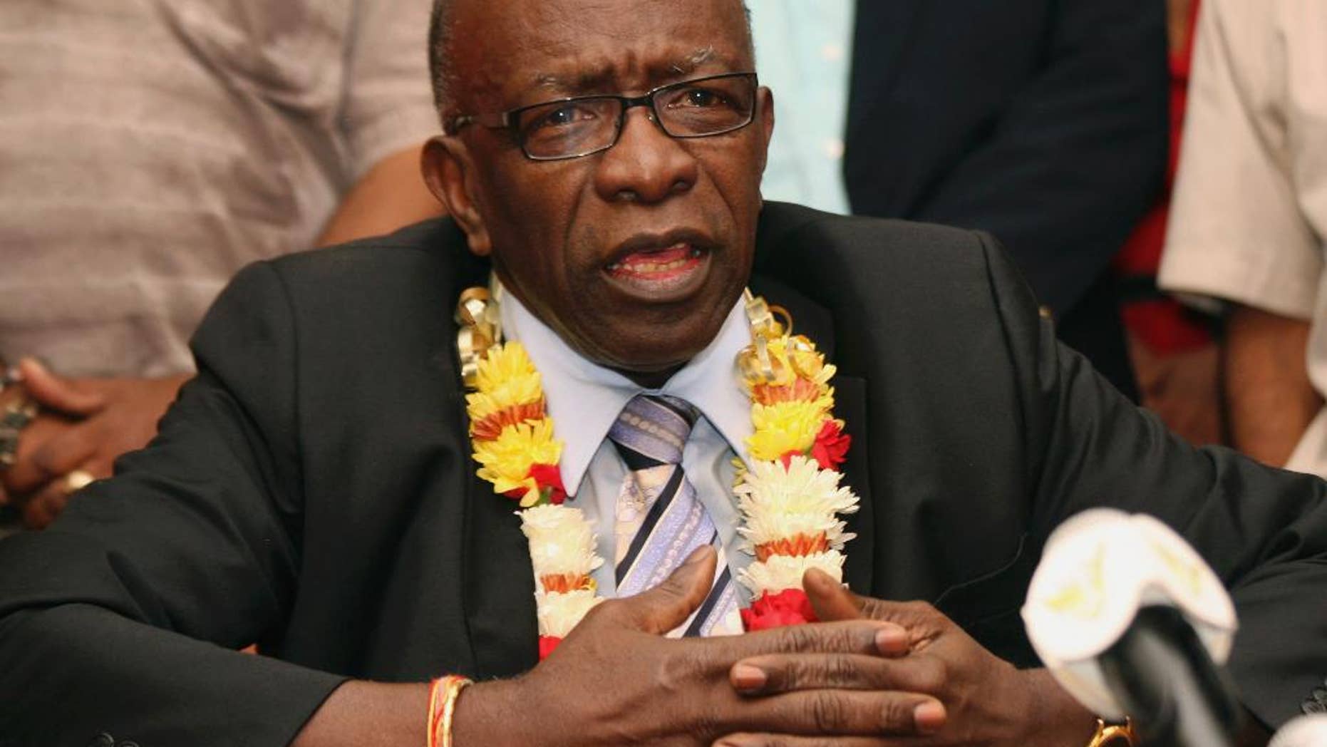 FILE - In this Thursday, June 2, 2011 file photo, suspended FIFA executive Jack Warner gestures during a news conference held shortly after his arrival at the airport in Port-of-Spain, in his native Trinidad and Tobago. Warner was one of the 14 people indicted Wednesday May 27, 2015 in the U.S. on corruption charges. (AP Photo/Shirley Bahadur, File)