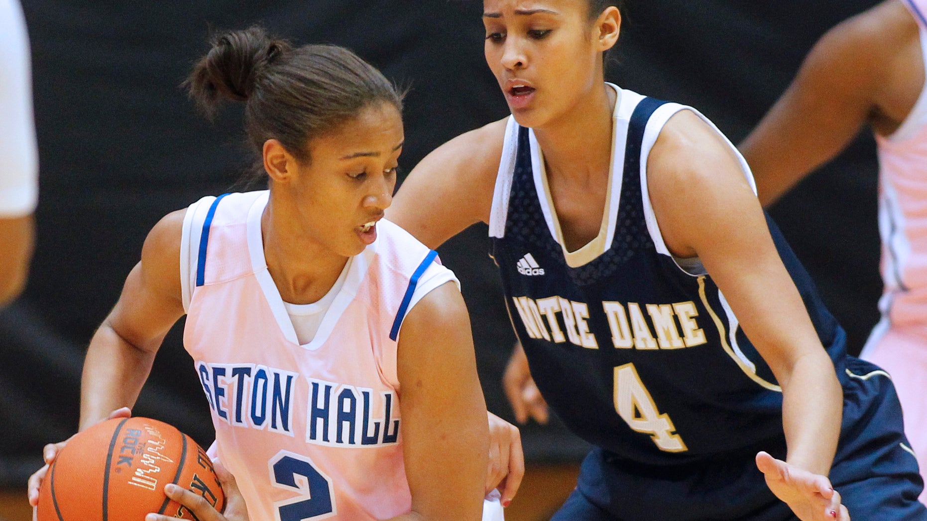 Seton Hall's Brittany Morris (2) attempts to get past Notre Dame's Skylar Diggins (4) during the second half of an NCAA college basketball game in South Orange, N.J. Saturday, Feb. 9, 2013. Notre Dame defeated Seton Hall 69-50. (AP Photo/Rich Schultz)