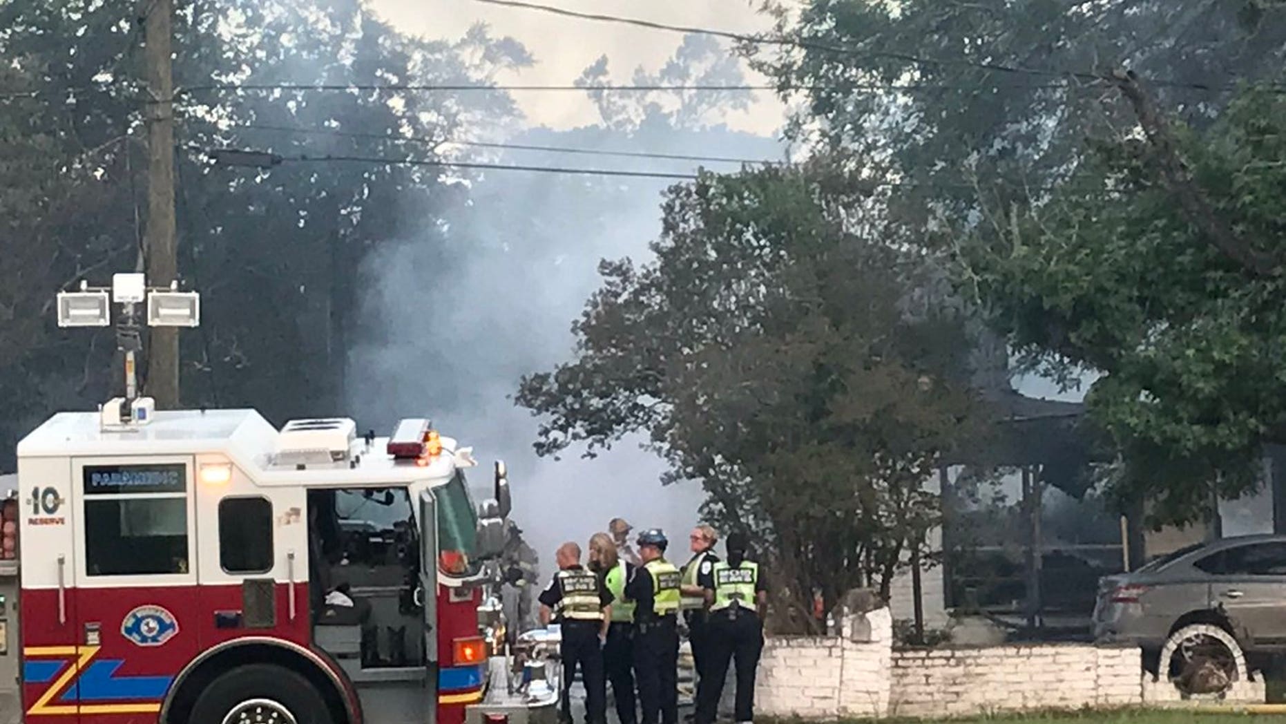 Emergency responders at the scene of the collapsed home.