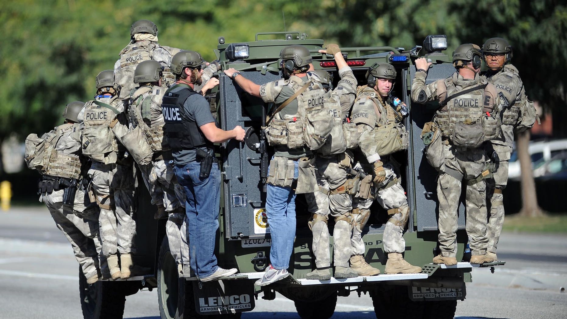 Dec. 2, 2015 - A SWAT vehicle carries police officers near the scene of the shooting in San Bernardino, Calif. (AP)