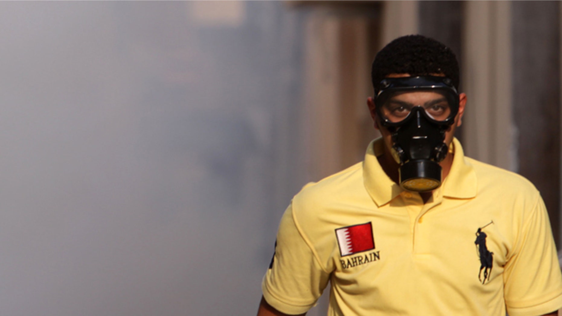 Sept. 24: A Bahraini man wearing a mask walks through tear gas during clashes between anti-government protesters and riot police n the Shiite village of Sanabis, Bahrain, on the edge of the capital of Manama.