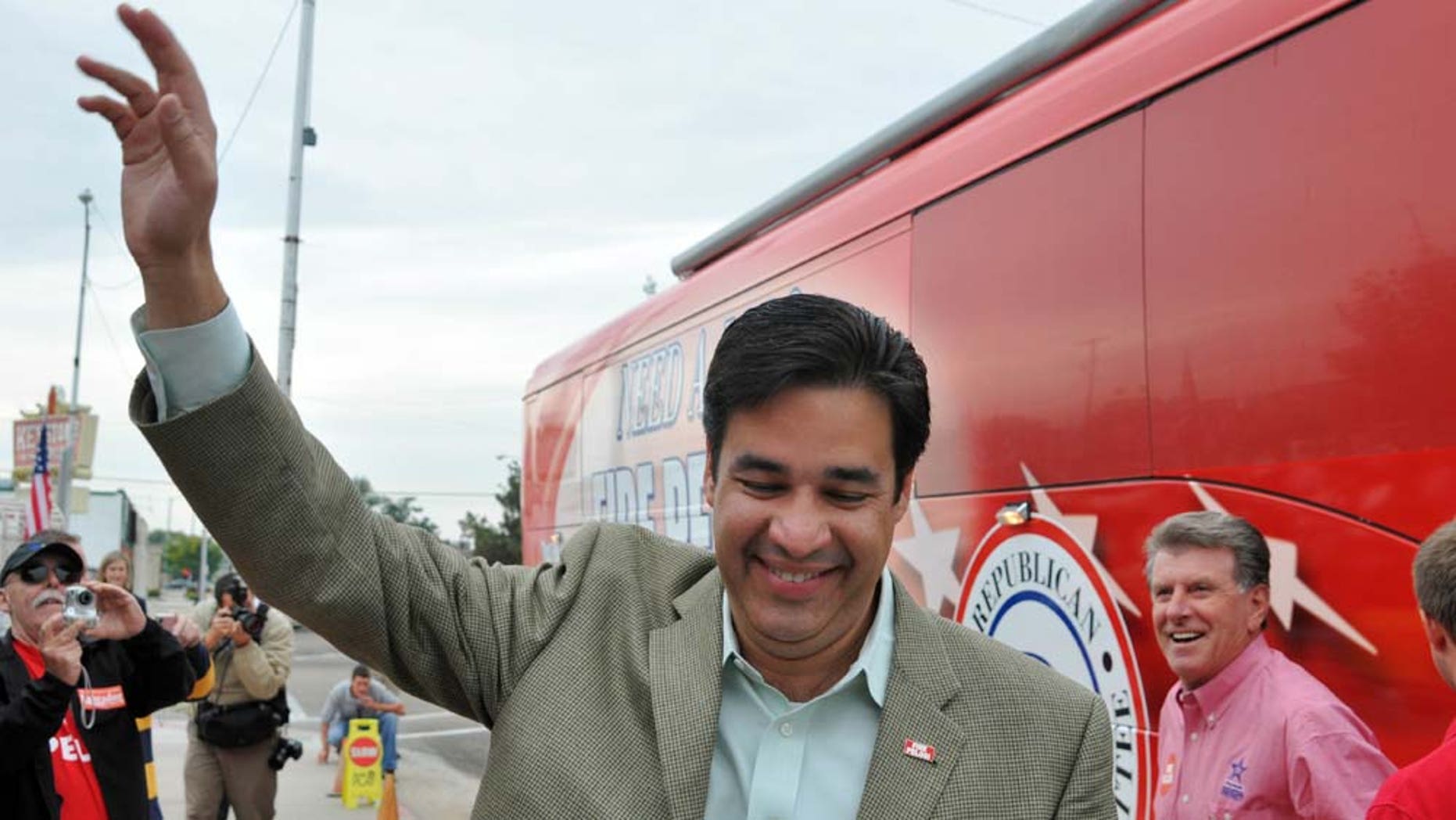 Raul Labrador, Republican challenger for Idaho's first congressional district, waves to an enthusiastic crowd flanked by Idaho governor C.L. "Butch" Otter, right, after arriving at a rally on Saturday October 9, 2010 in Caldwell, Idaho. Labrador, an attorney and two-term state lawmaker, is bidding to unseat Democrat Walt Minnick. (AP Photo/Idaho Press-Tribune, Mike Vogt)