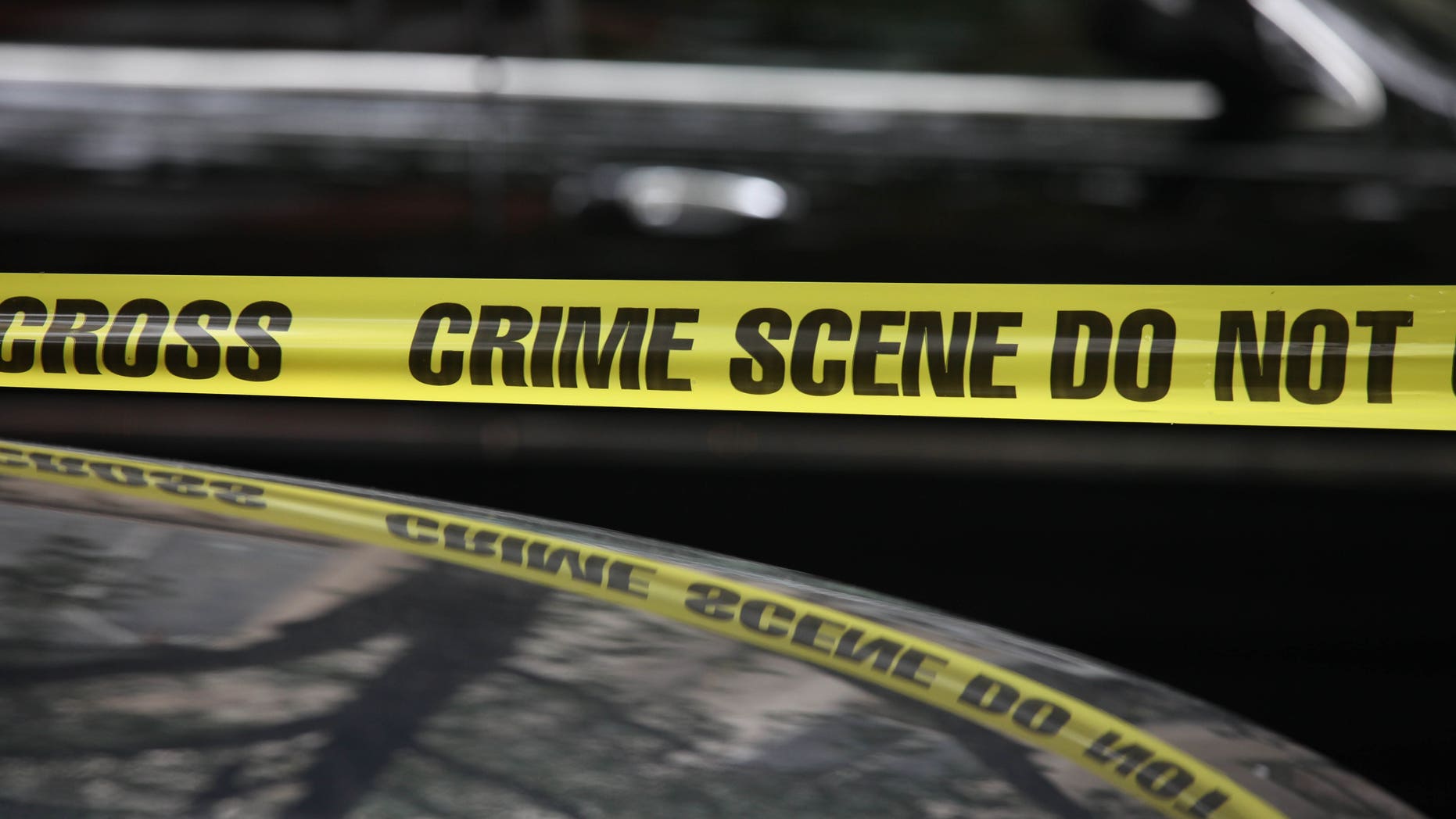 NEW YORK, NY - AUGUST 22: Crime scene tape at the funeral for former "Bachelor" contestant Gia Allemand at Trinity Grace Church on August 22, 2013 in New York, New York. Allemand passed away on Wednesday, August 14th of an apparent suicide. (Photo by Rob Kim/Getty Images)