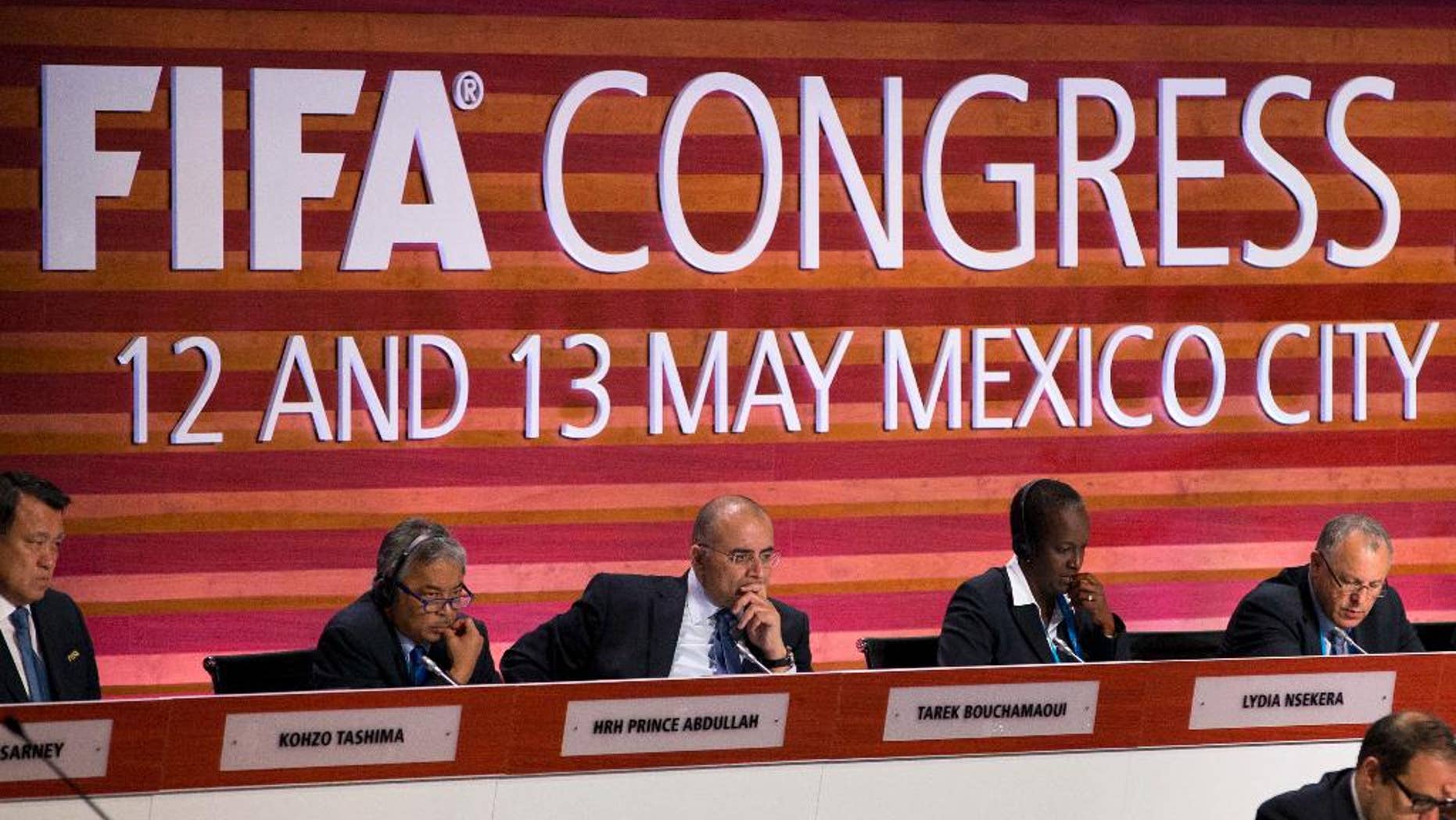 FIFA council members listen during the 66th FIFA Congress, in Mexico City, Friday, May 13, 2016. From left, are Kohzo Tashima of Japan, Prince Abdullah of Malaysia, Tarek Bouchamaoui of Tunisia, Lydia Nsekera of Burundi, and Hany Abo Rida of Egypt. (AP Photo/Rebecca Blackwell)