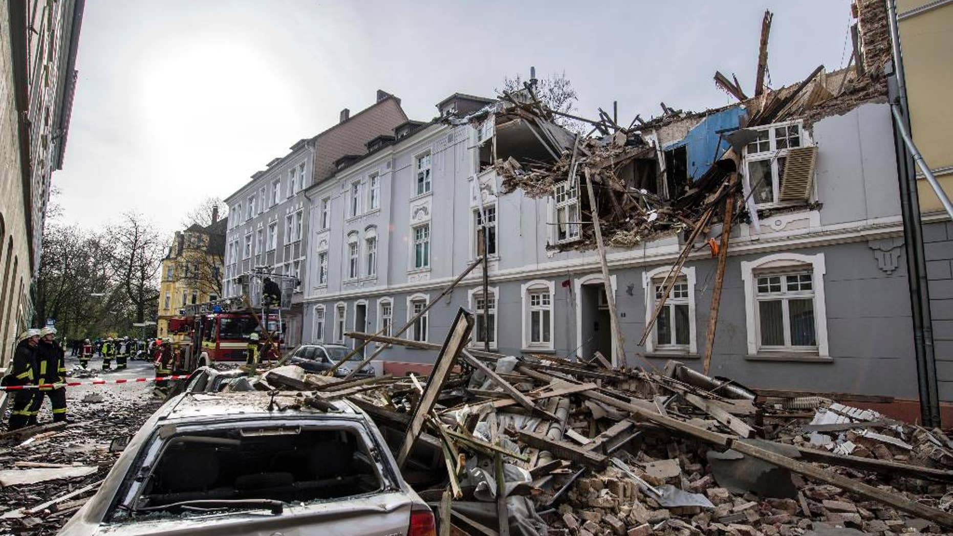 Debris sits on a street after an explosion in an apartment building in Dortmund, western Germany, Friday, March 31, 2017. Police said one person was injured, another person is still missing. (Bernd Thissen/dpa via AP)