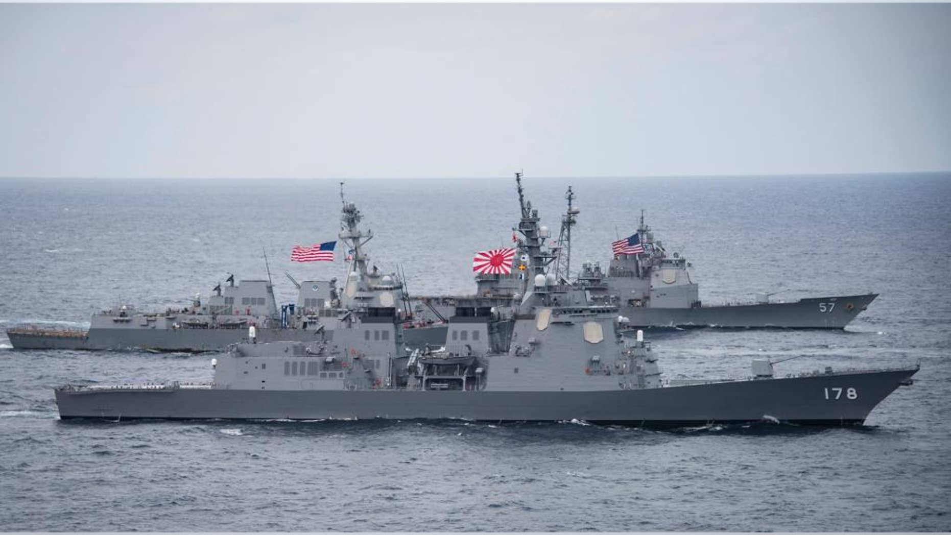In this Friday, April 28, 2017 photo released by the U.S. Navy, the Japan Maritime Self-Defense Force destroyer JS Ashigara (DDG 178), foreground, the Arleigh Burke-class guided-missile destroyer USS Wayne E. Meyer (DDG 108), center, and the Ticonderoga-class guided-missile cruiser USS Lake Champlain (CG 57) transit the Philippine Sea as they accompany the Nimitz-class aircraft carrier USS Carl Vinson (CVN 70) for the ongoing joint exercises. (Mass Communication Specialist 2nd Class Z.A. Landers/U.S. Navy via AP)