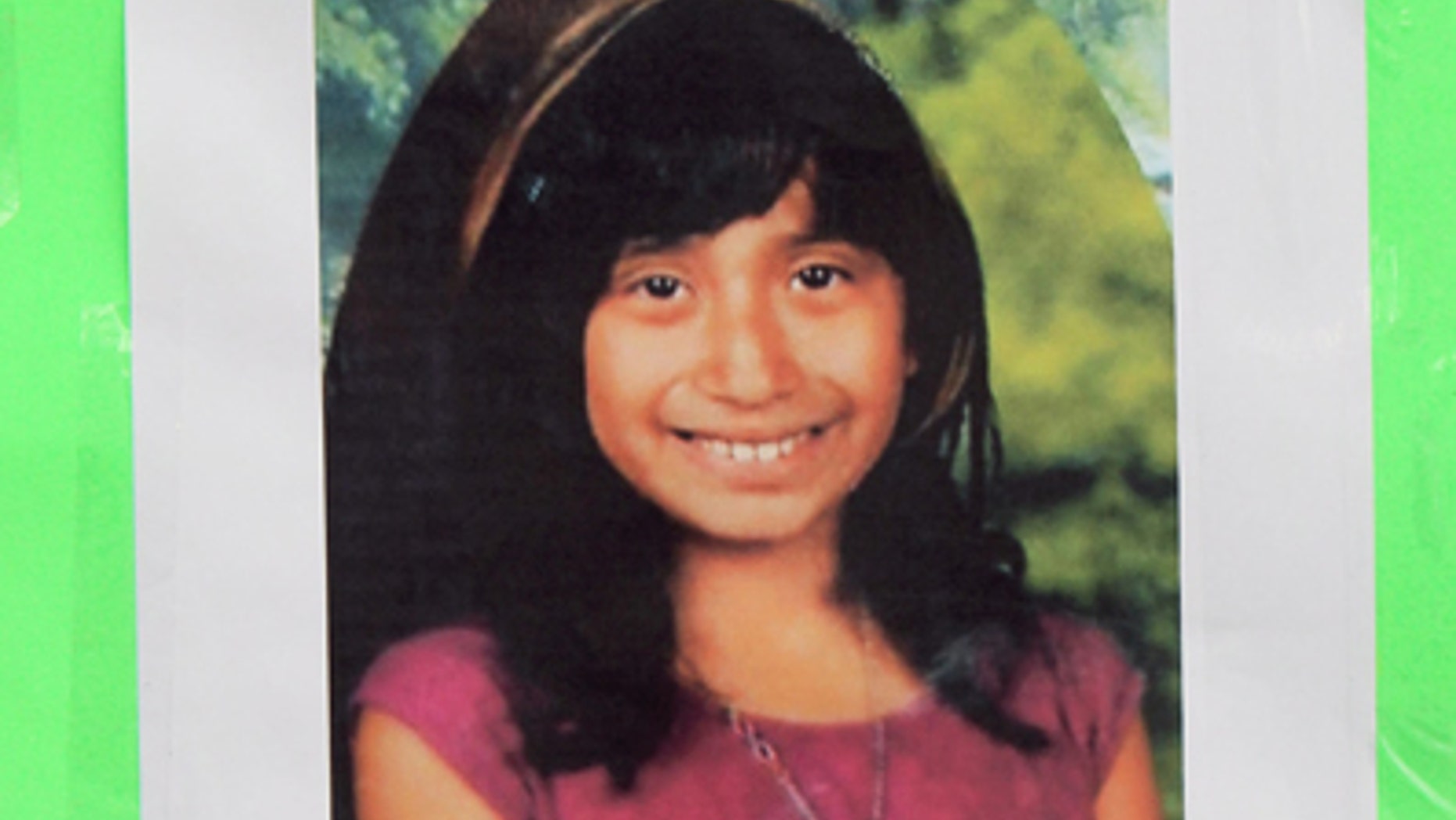 Feb. 27, 2012: A photo of Joanna Ramos, 11,with a note, is left at a memorial outside Willard Elementary school in Long Beach, Calif. Ramos, who died after a fight with another 11-year-old in an alley near their elementary school underwent emergency surgery for a blood clot on her brain before her death, her sister said Monday.