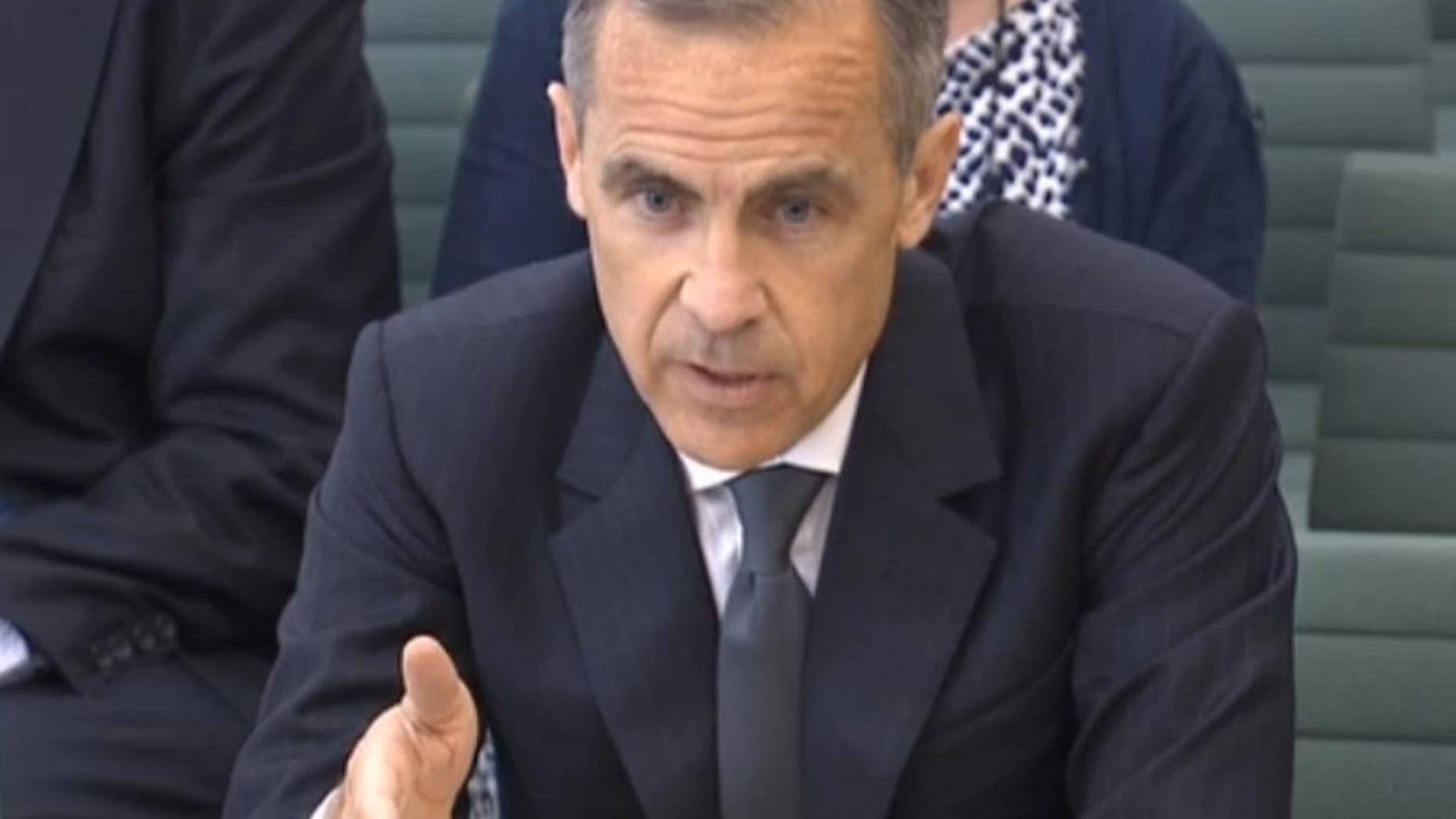 In this image taken from video Governor of the Bank of England Mark Carney gives evidence to Britain's parliamentary Commons Treasury Committee on the Bank of England inflation report in London Tuesday May 24, 2016. (PA via AP) UNITED KINGDOM OUT