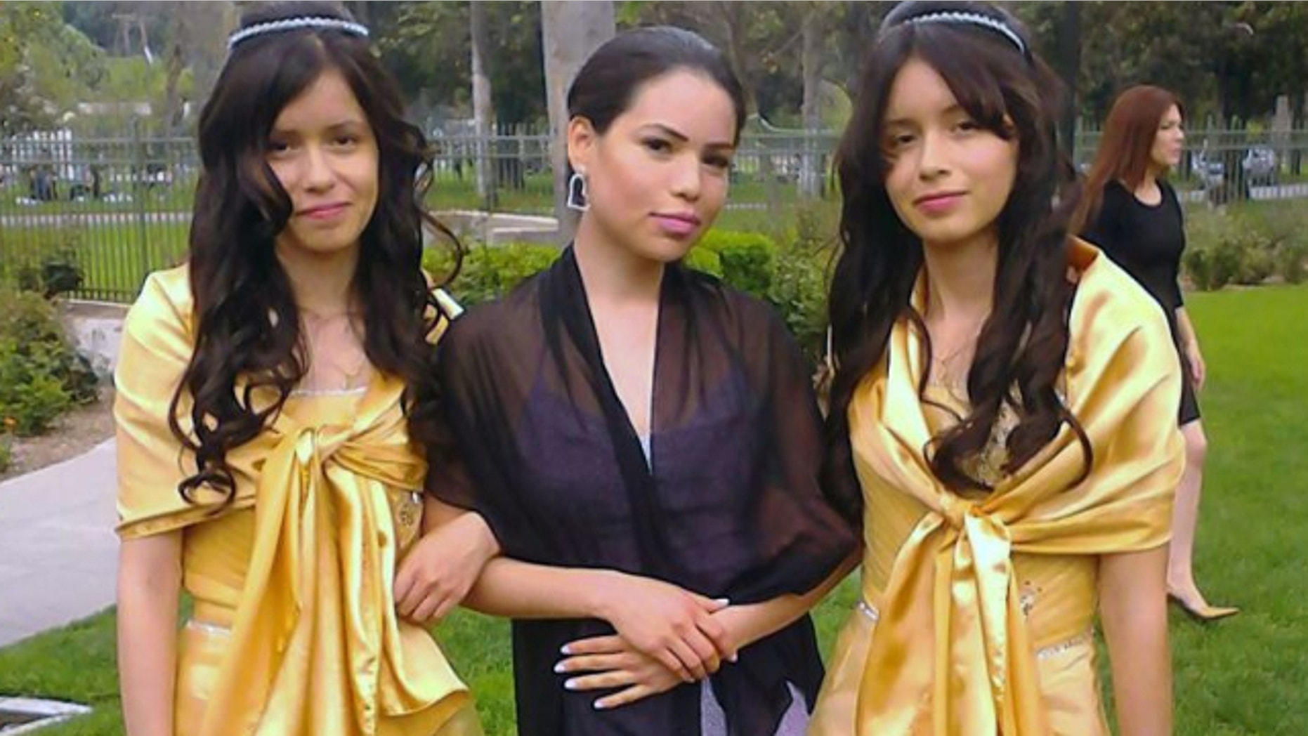 UNDATED: This 2013 photo provided by Miguel Serrato shows twin sisters Marisol Serrato, 17, left, and Marisa Serrato, right, with their sister-in-law Ivette Serrato during a wedding in Riverside, Caif.