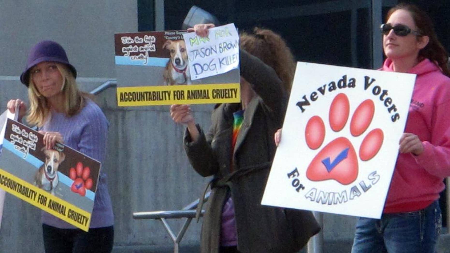 A half dozen animal rights activists protested Thursday, Oct. 16, 2014, outside Reno Justice Court where Jason Brown, 24, was to appear later in the day at a status hearing on charges accusing him of torturing and killing several dogs in July. Leaders of Nevada Voters for Animals are urging the maximum punishment if Brown is convicted of all seven counts, which could total more than 20 years in prison. (AP Photo/Scott Sonner).