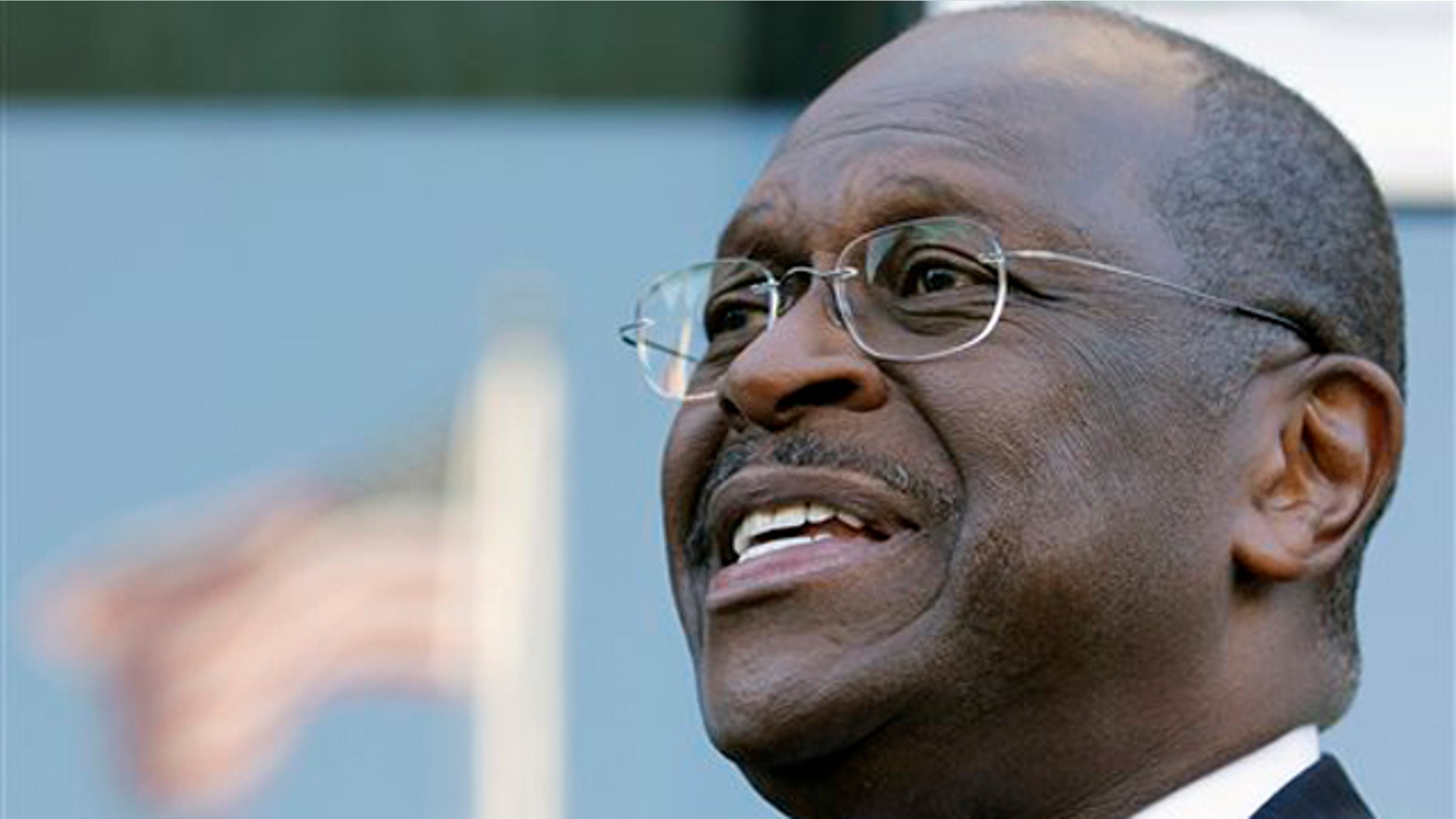 Presidential candidate Herman Cain speaks with the media after an interview in Washington, D.C., on Oct. 16.