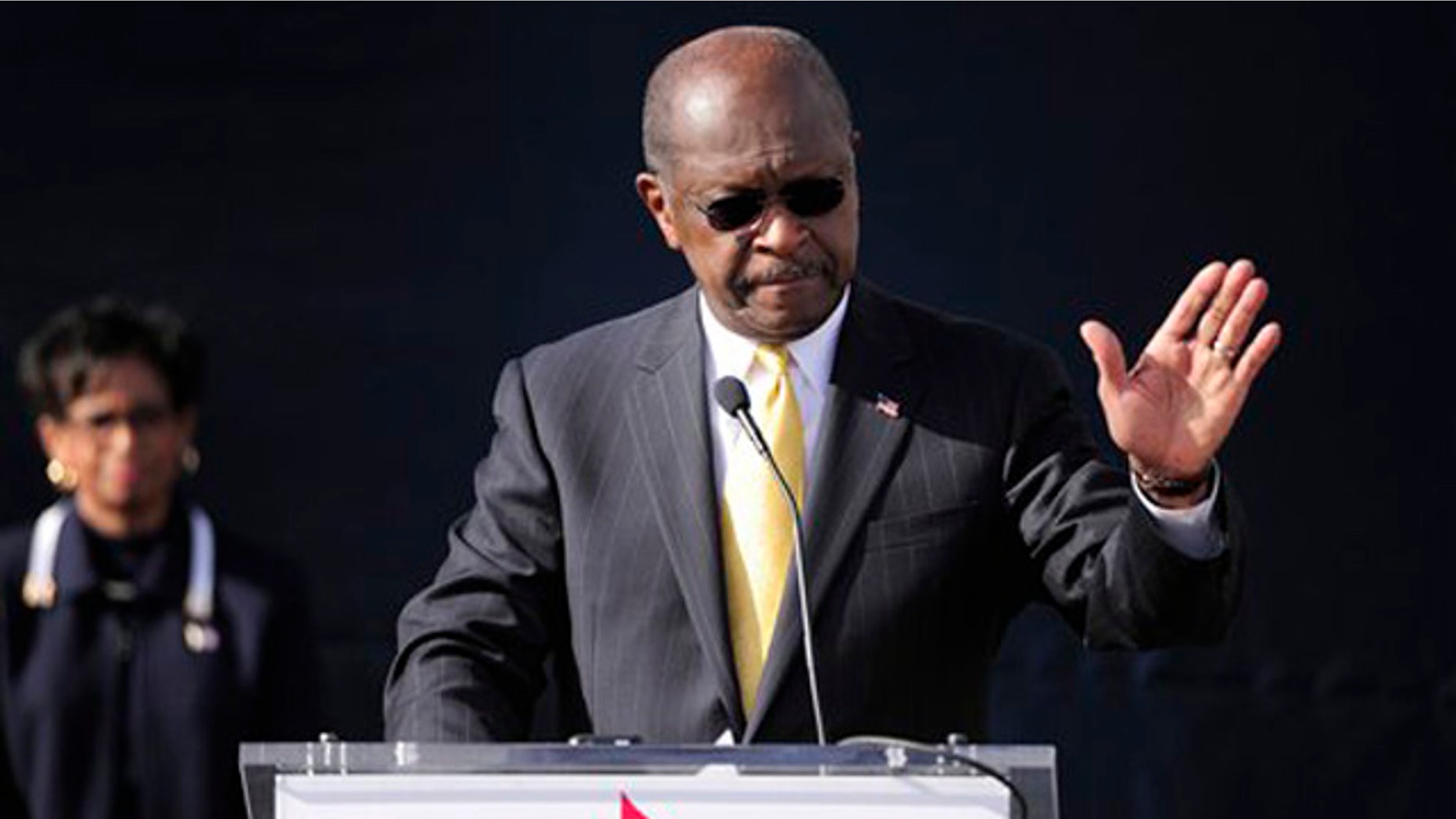 Dec. 3, 2011: Herman Cain announces he is suspending his campaign as his wife Gloria, left, looks on in Atlanta.