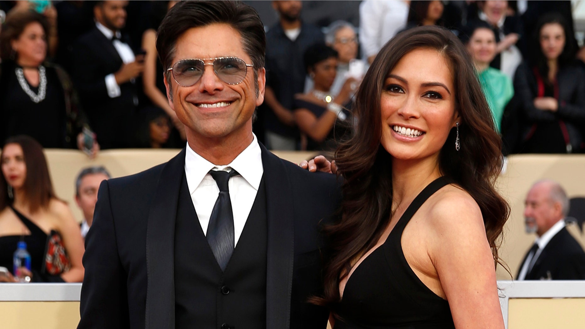Actor John Stamos and Caitlin McHugh at the 24th Screen Actors Guild Awards.