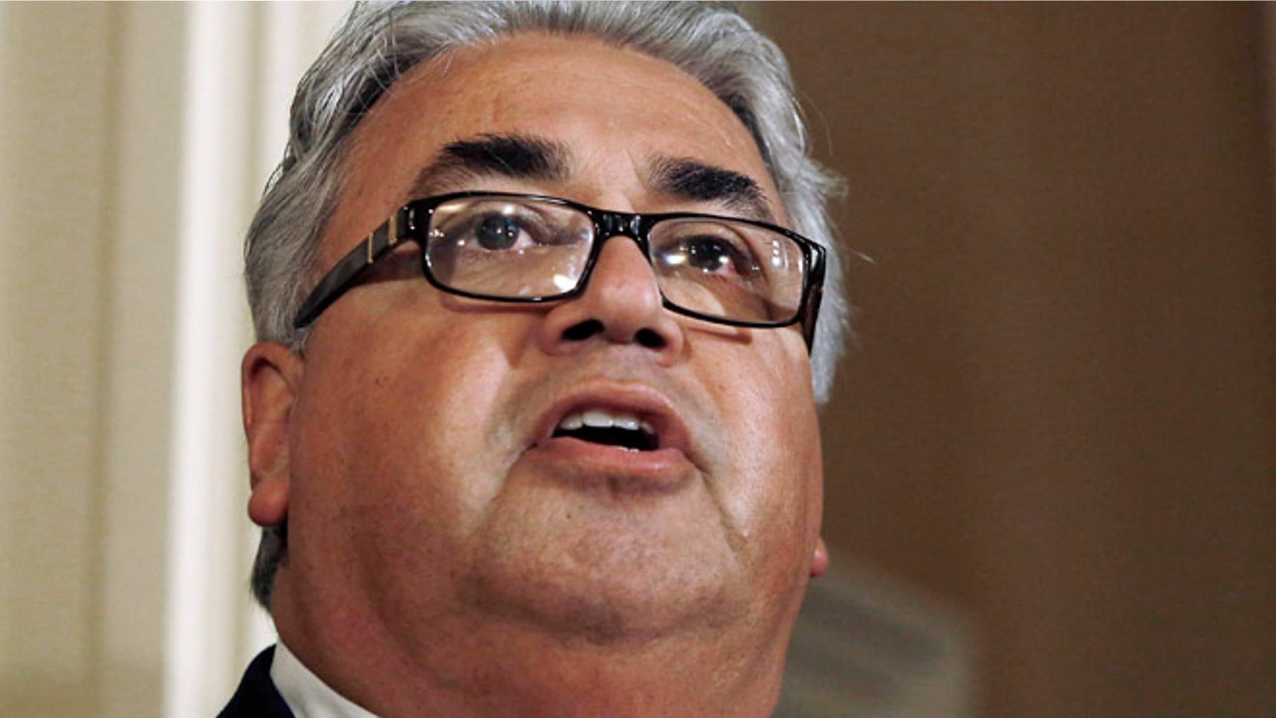 June 10, 2013, In this file photo, State Sen. Ron Calderon, D-Montebello, left, holds a news conference at the Capitol in Sacramento, Calif.