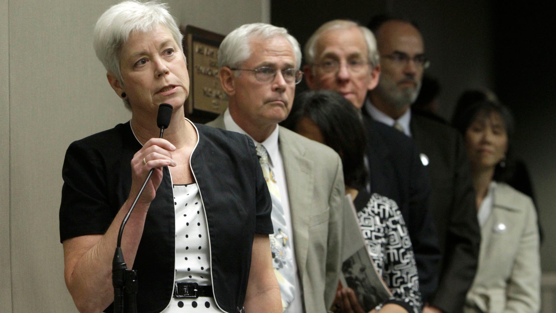 Amanda Wilcox, left, accompanied by her husband Nick Wilcox, second from left, whose daughter, Laura, was killed in a 2001 Nevada County shooting spree, joined others in calling on lawmakers to approve a bill aimed at abolishing capital punishment, at a hearing of the Assembly Public Safety Committee at the Capitol in Sacramento, Calif., Thursday, July 7, 2011.