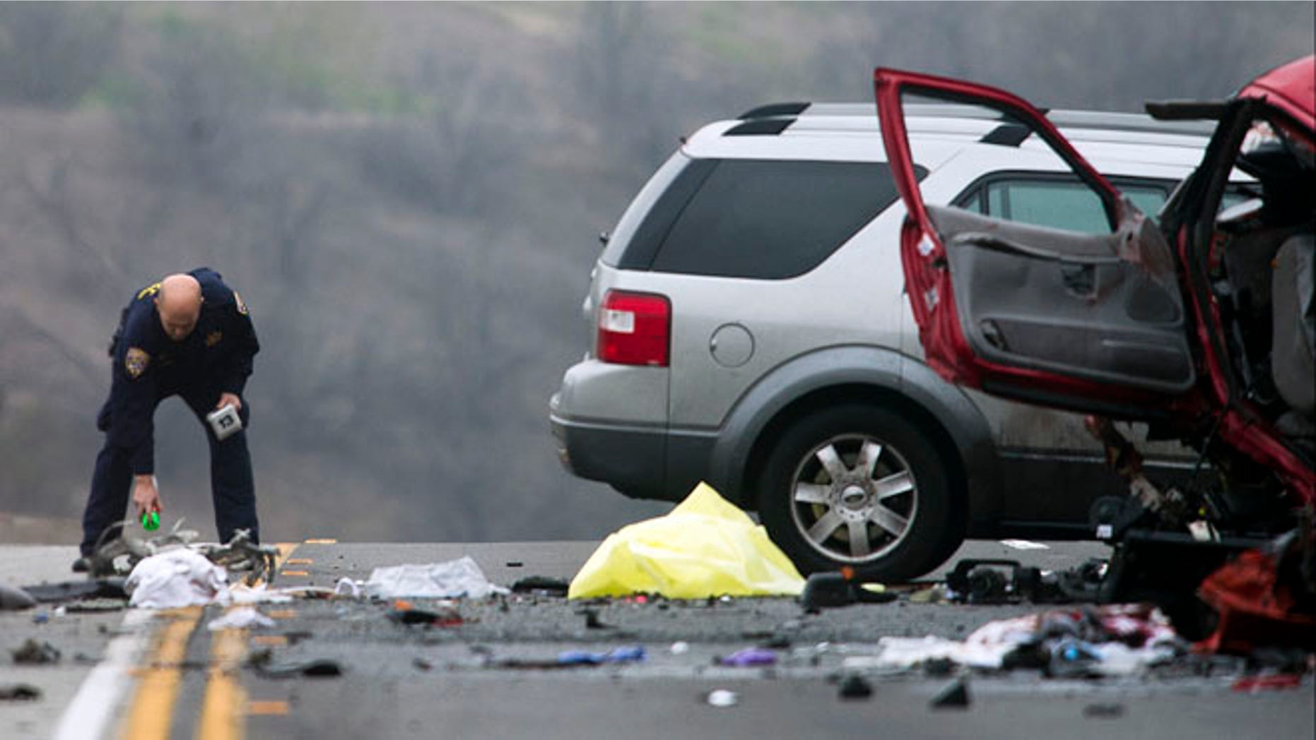 Feb. 9, 2013: Officials investigate the scene of a multiple vehicle accident where six people were killed on the westbound Pomona Freeway in Diamond Bar, Calif.