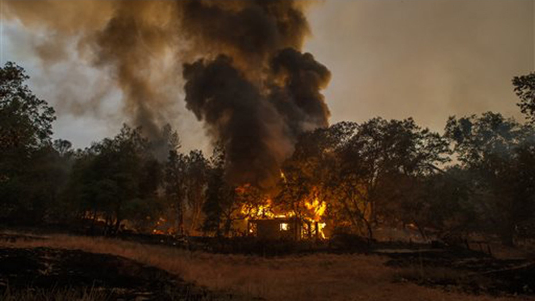 Sept. 10, 2015: In this photo a home burns near Mokelumne Hill, in Jackson, Calif.