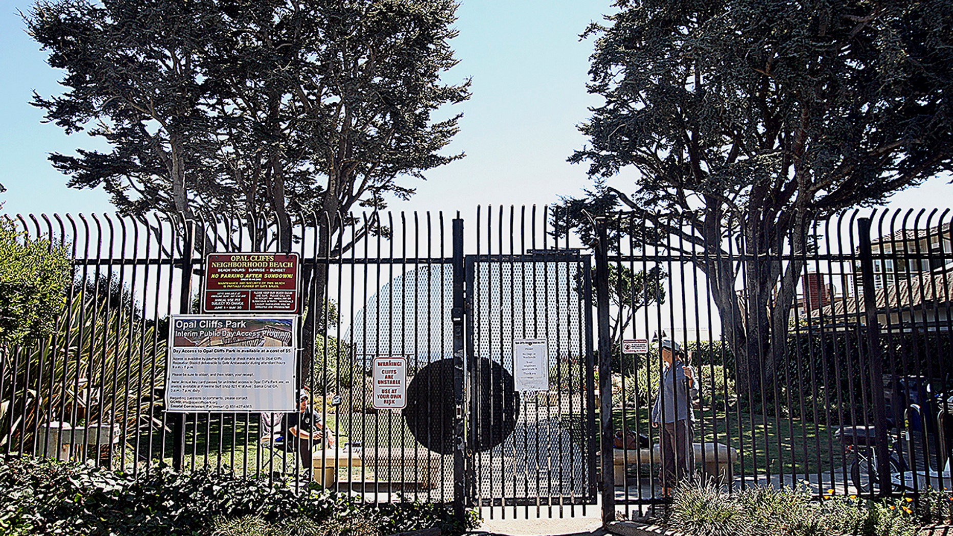 This Aug. 31, 2016, photo shows the gate to Opal Cliffs Park that leads to Opal Cliffs Neighborhood Beach, more commonly known as Privates surf break, in the Live Oak neighborhood of an unincorporated part of Santa Cruz County, Calif.