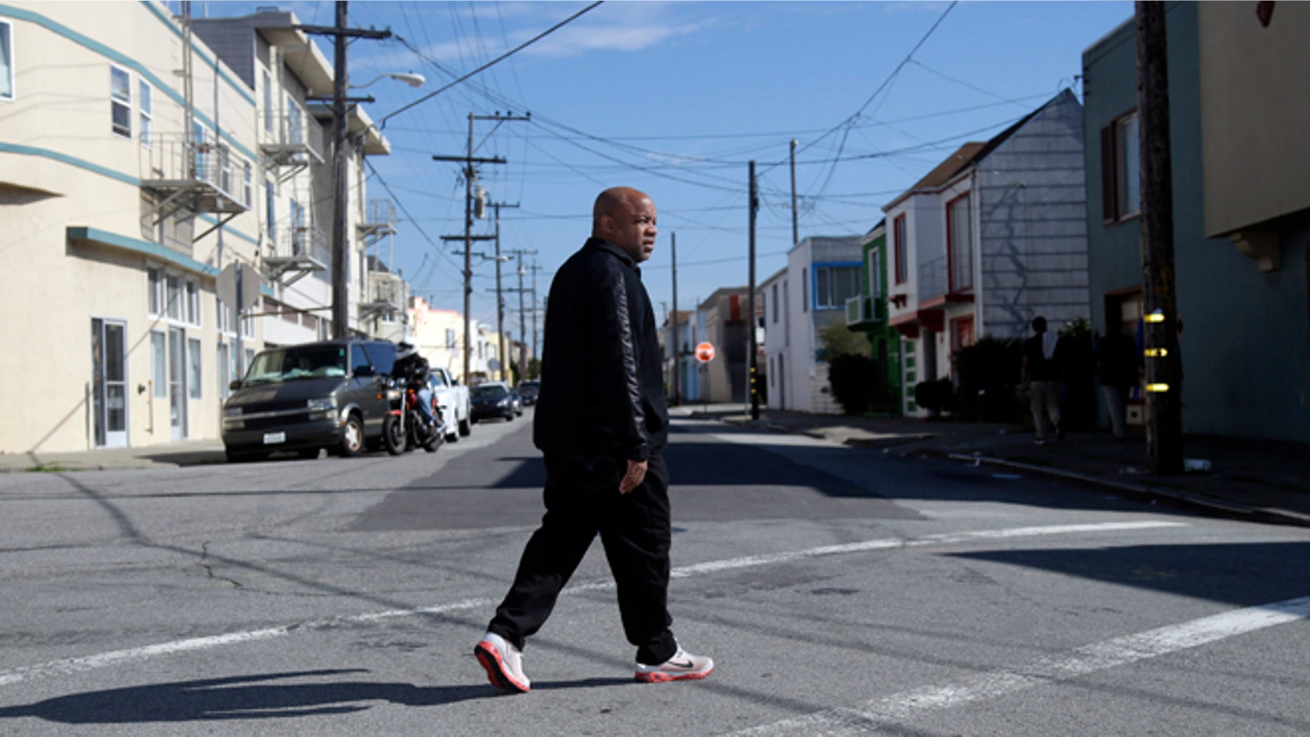 Feb. 13, 2014: Ernest Morgan walks around his neighborhood in San Francisco.