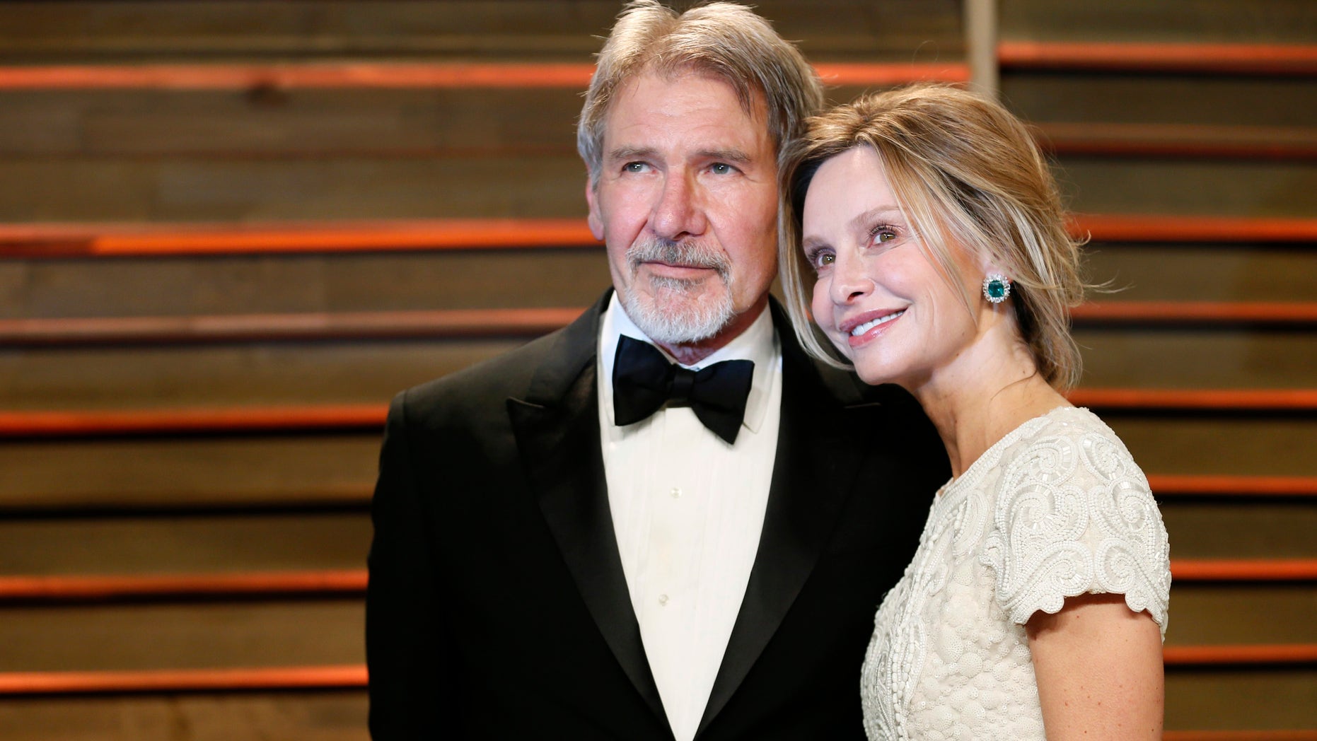 Actor Harrison Ford and his wife Calista Flockhart arrive at the 2014 Vanity Fair Oscars Party in West Hollywood, California March 2, 2014. REUTERS/Danny Moloshok (UNITED STATES - Tags: ENTERTAINMENT)(OSCARS-PARTIES) - RTR3FYET