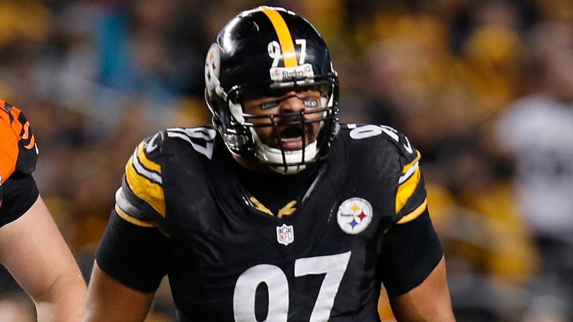 PITTSBURGH, PA - DECEMBER 28: Cameron Heyward #97 of the Pittsburgh Steelers reacts after sacking Andy Dalton #14 of the Cincinnati Bengals during the second quarter at Heinz Field on December 28, 2014 in Pittsburgh, Pennsylvania. (Photo by Gregory Shamus/Getty Images)