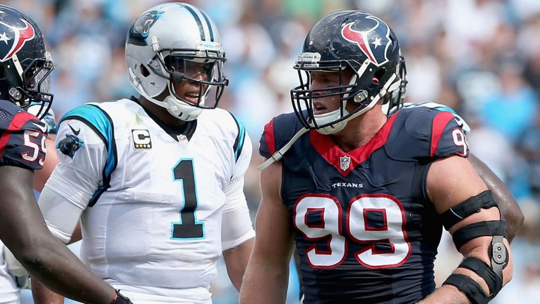 CHARLOTTE, NC - SEPTEMBER 20: Cam Newton #1 of the Carolina Panthers and J.J. Watt #99 of the Houston Texans in action during their game at Bank of America Stadium on September 20, 2015 in Charlotte, North Carolina. (Photo by Streeter Lecka/Getty Images)