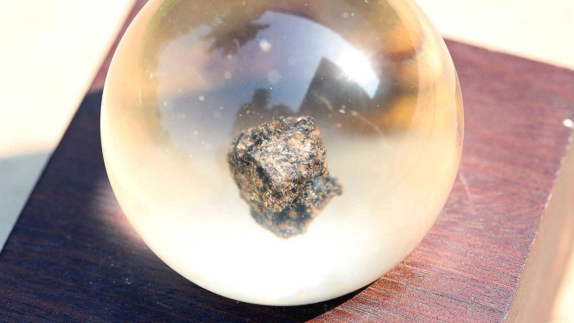 Encased in lucite, this 1.142-gram moon rock was returned to Earth by Apollo 17 in 1972 and presented to Cambodia a year later.