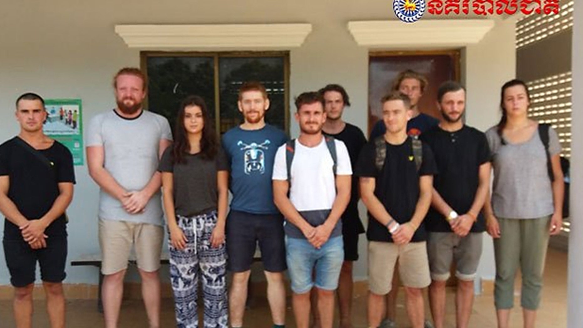 The group of ten tourists detained are being being charged with "producing pornography" after Cambodian police discovered suggestive photos of the group during a raid. They could face up to a year in a Cambodian prison.