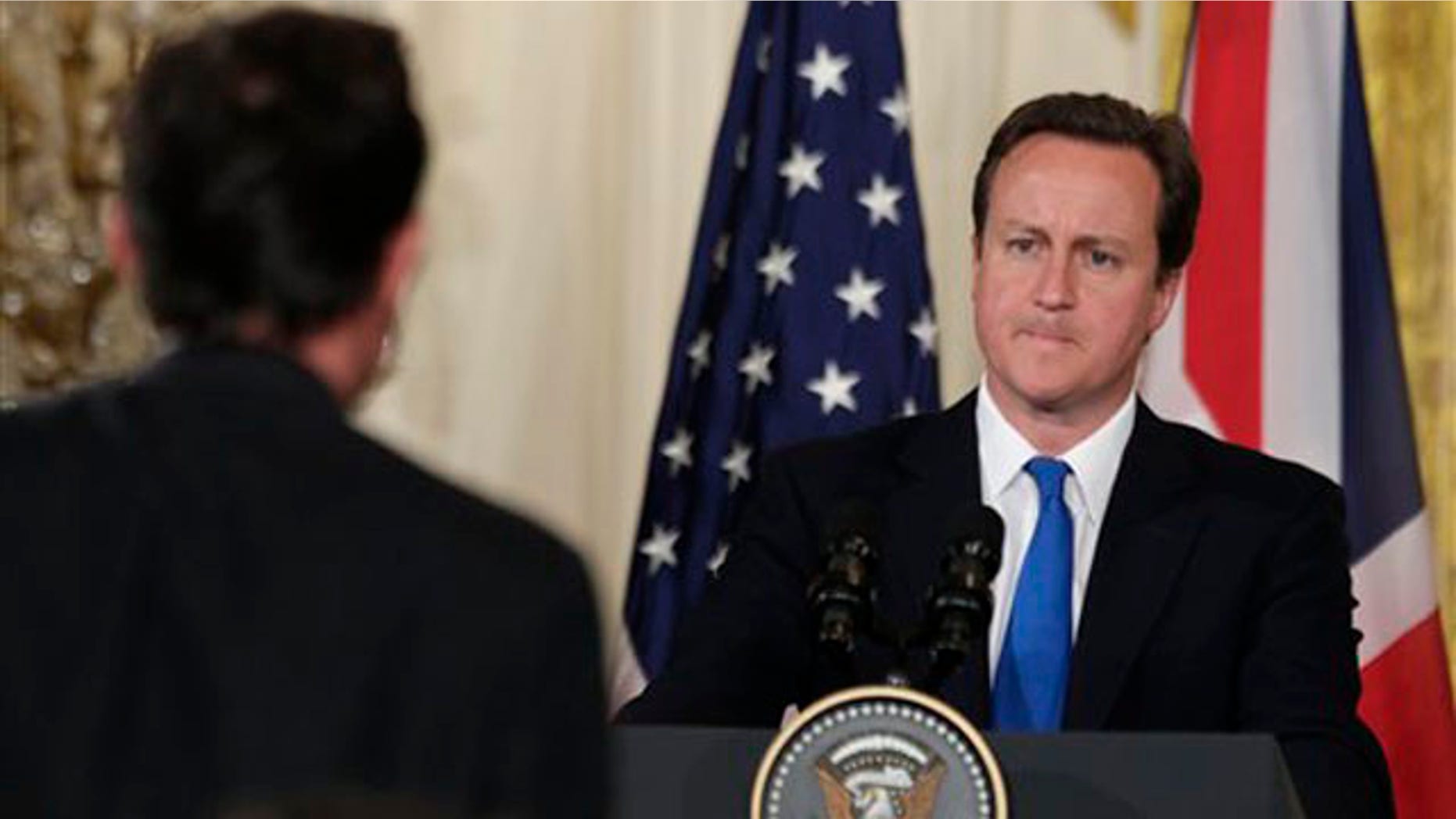 British Prime Minister David Cameron is seen at a news conference with President Obama, not shown, in the East Room of the White House July 20. (AP Photo)