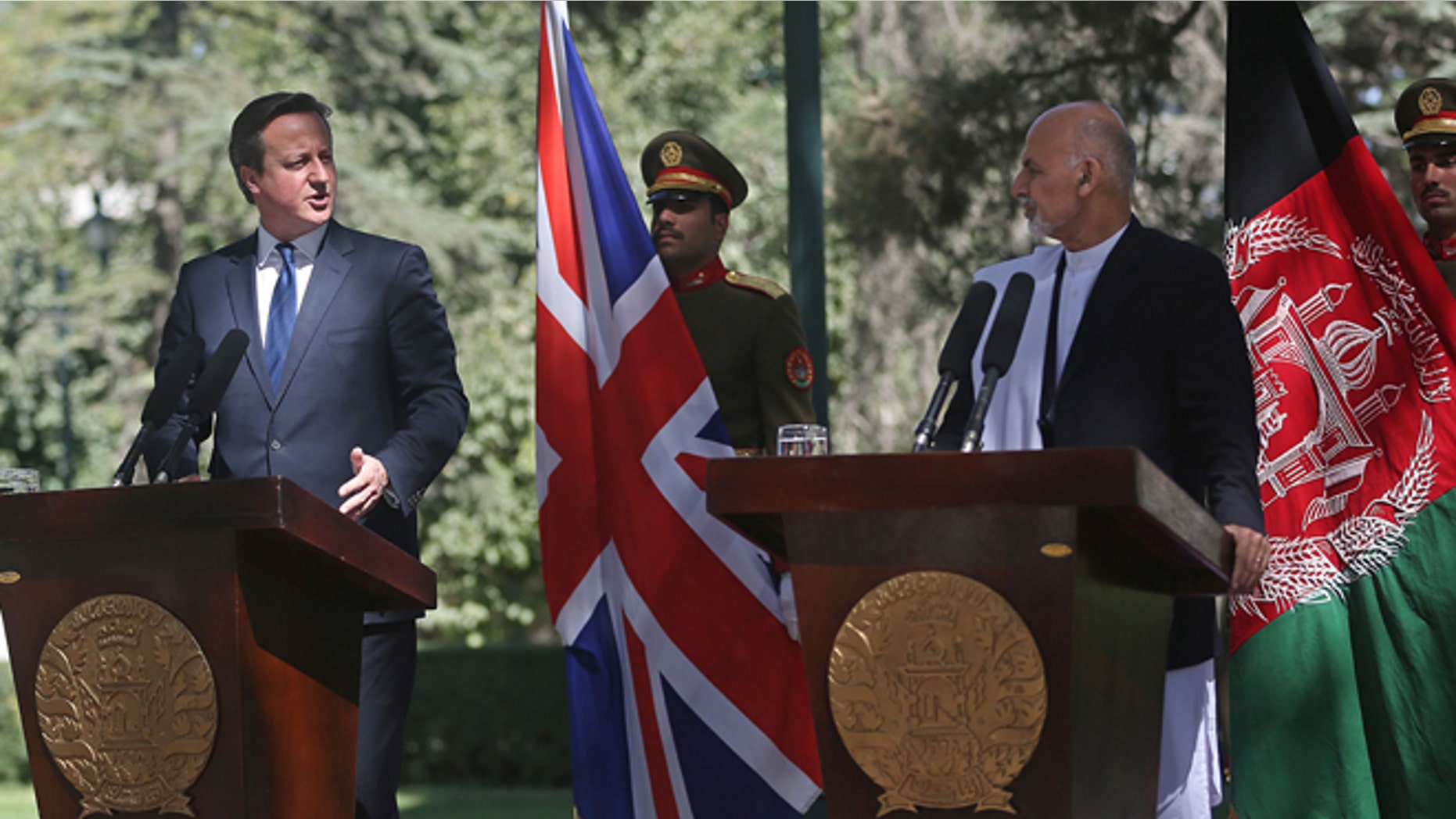 Oct. 3, 2014: Afghanistan's president Ashraf Ghani Ahmadzai, second right, listens as Britain's Prime Minister David Cameron talks during a news conference at the presidential palace in Kabul, Afghanistan. (AP)