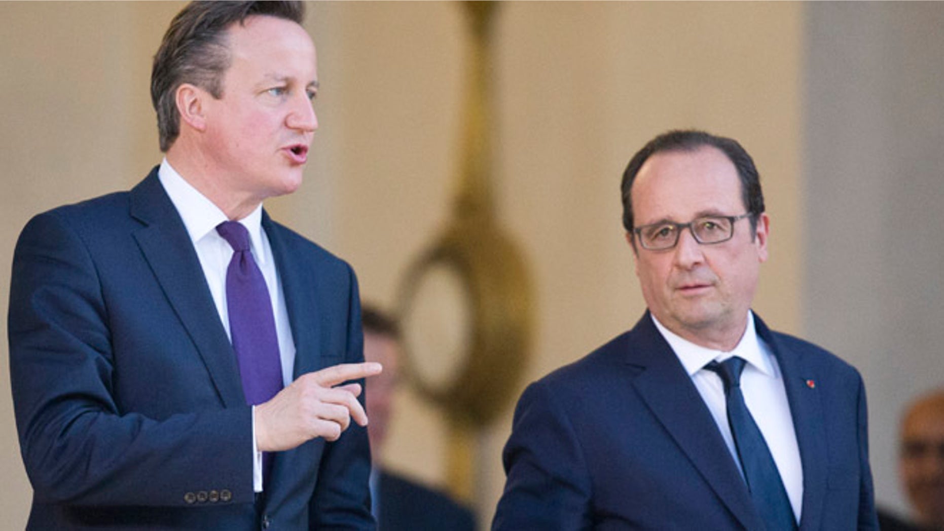 May 28, 2015: Britain's Prime Minister David Cameron, left, leaves with French President Francois Hollande, after their meeting, at the Elysee Palace in Paris. (AP)