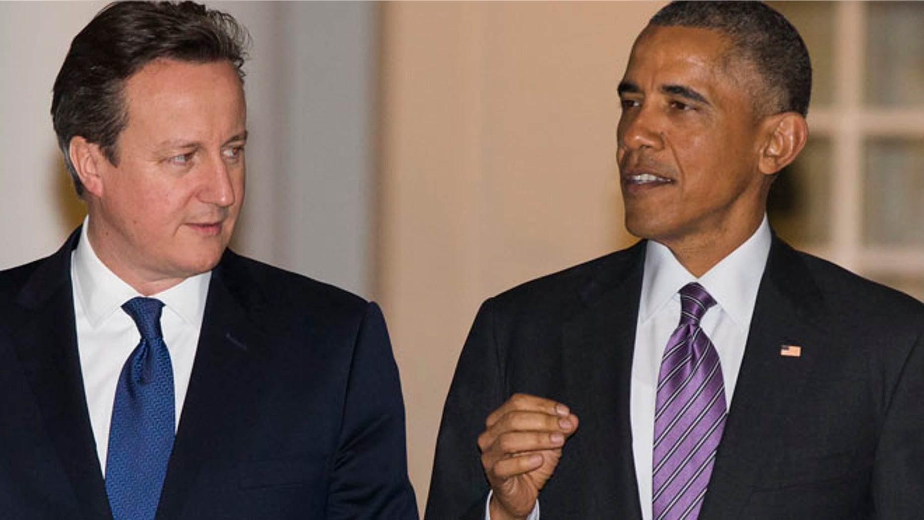 Jan. 15, 2015: President Barack Obama, right, walks with British Prime Minister David Cameron on the West Wing Colonnade of the White House in Washington. (AP)