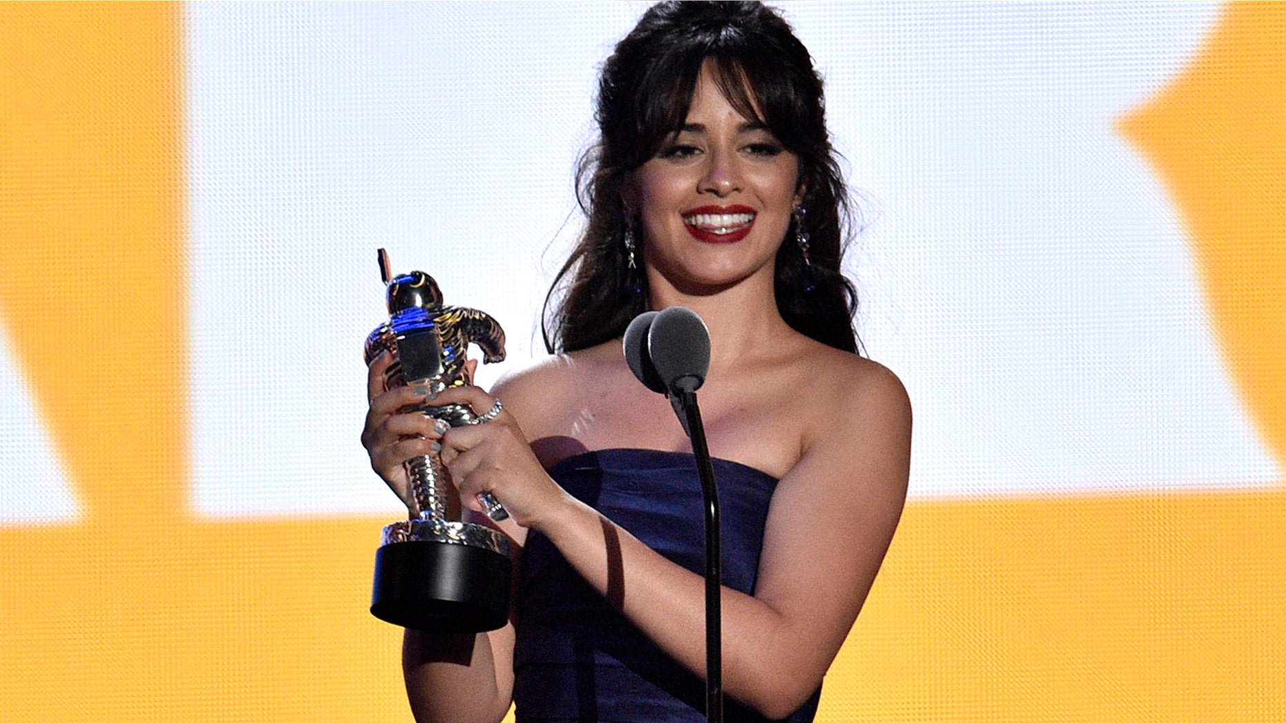 Camila Cabello accepts the award for artist of the year at the MTV Video Music Awards at Radio City Music Hall on Monday, Aug. 20, 2018, in New York.