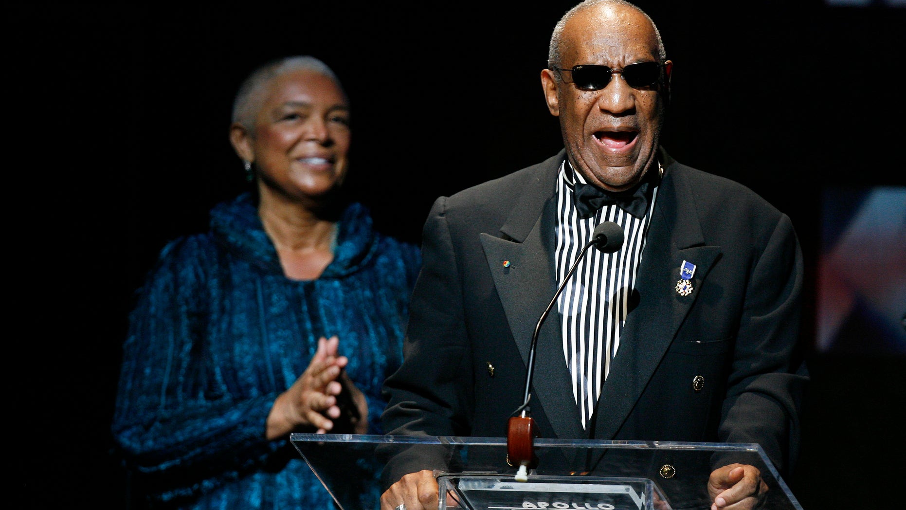 Comedian Bill Cosby addresses the crowd in front of his wife, Camille Cosby, after being honored during the Apollo Theatre's 75th anniversary gala in New York, June 8, 2009. REUTERS