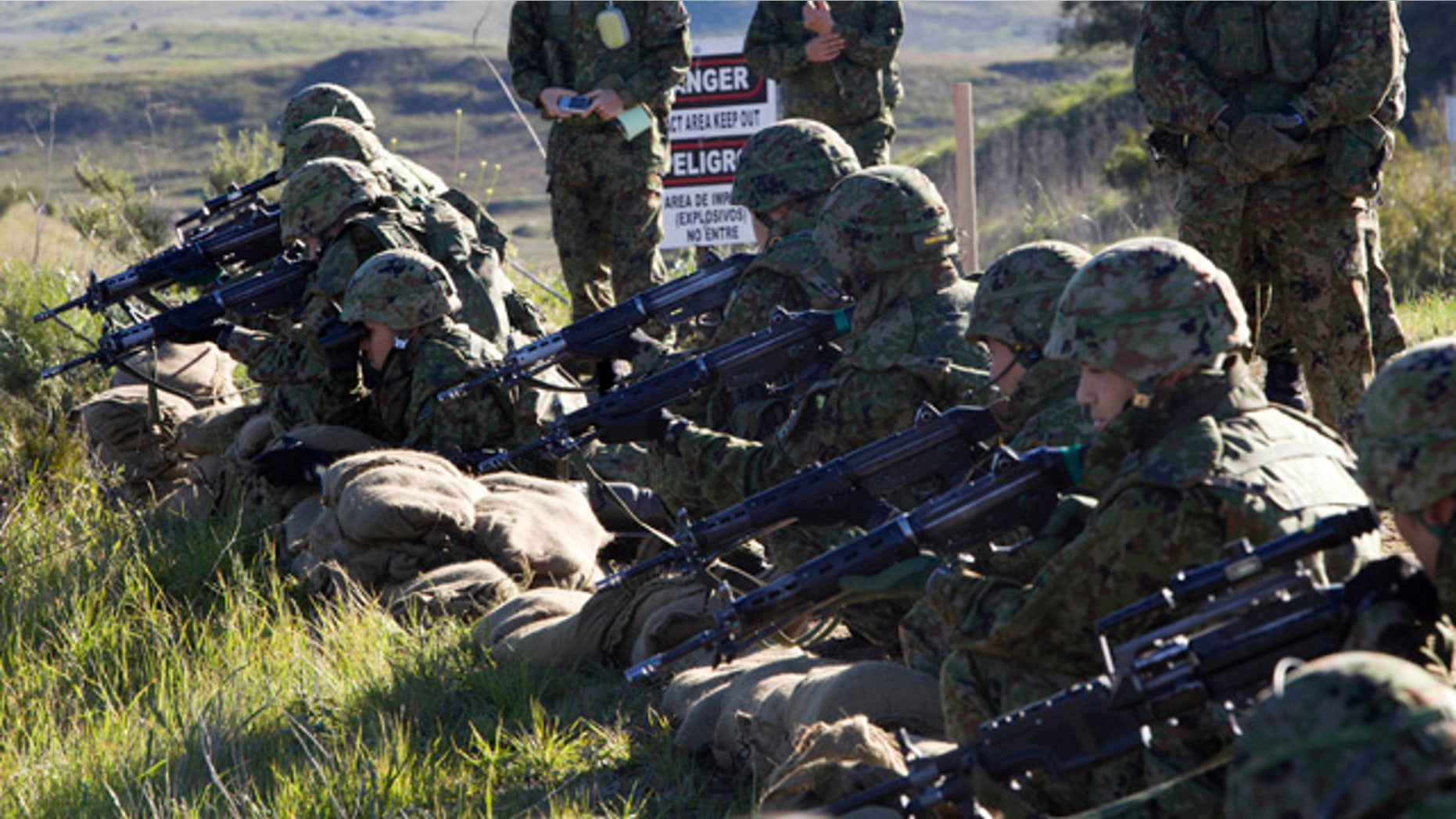Japan Ground Self-Defense Force (JGSDF) soldiers and the Western Army Infantry Regiment participate in a live exercise during "Iron Fist 2012" at Marine Corps Base Camp Pendleton, California.