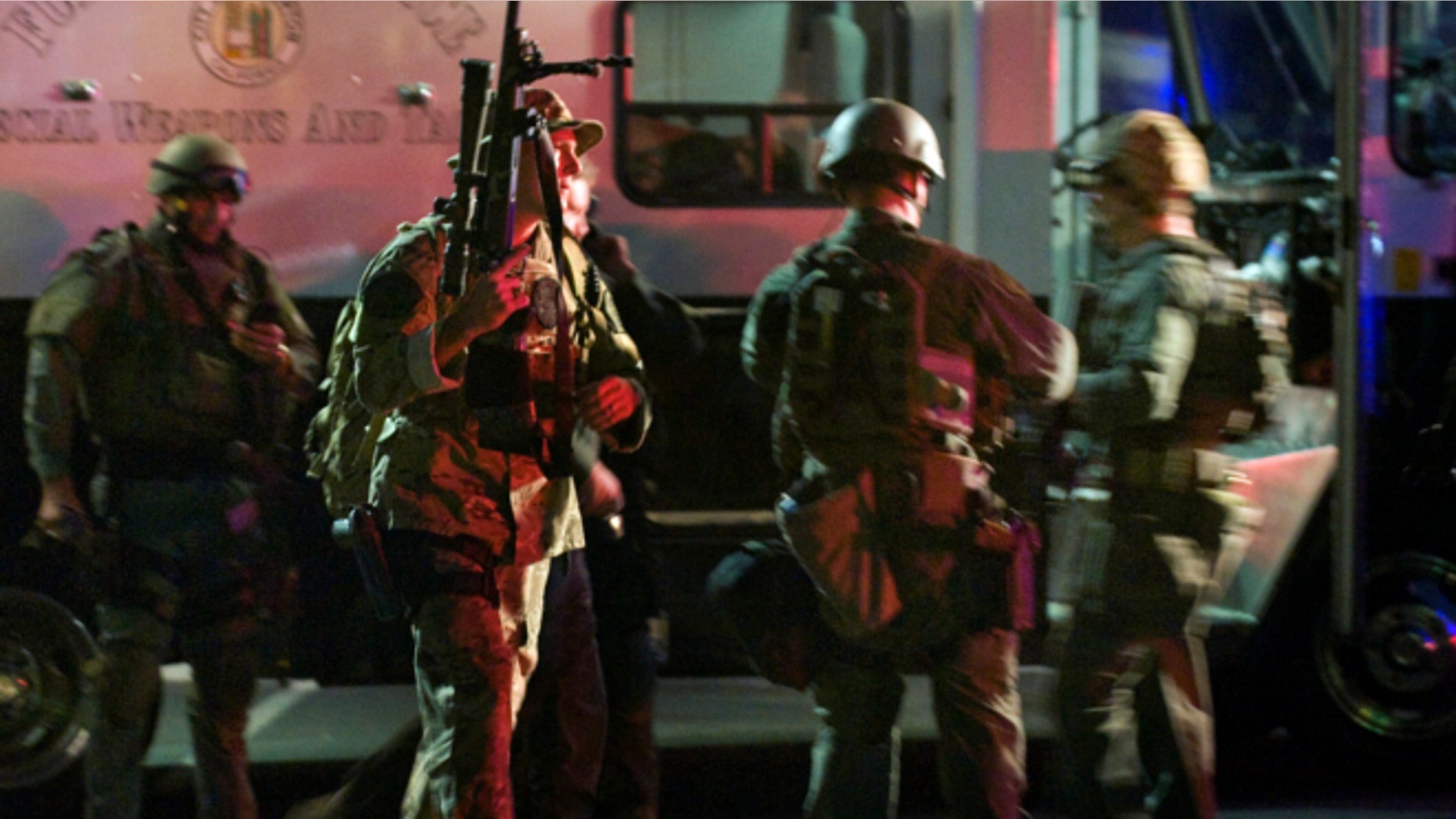 Dec. 12, 2012: SWAT team members form up near a command post south of the Cal State Fullerton campus in Fullerton, Calif.