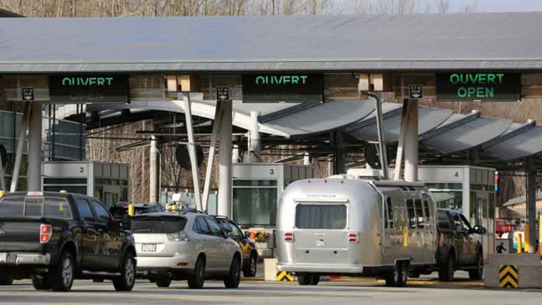 Cars enter lanes for Canada customs and border inspection after arriving from the United States to Surrey, British Columbia.