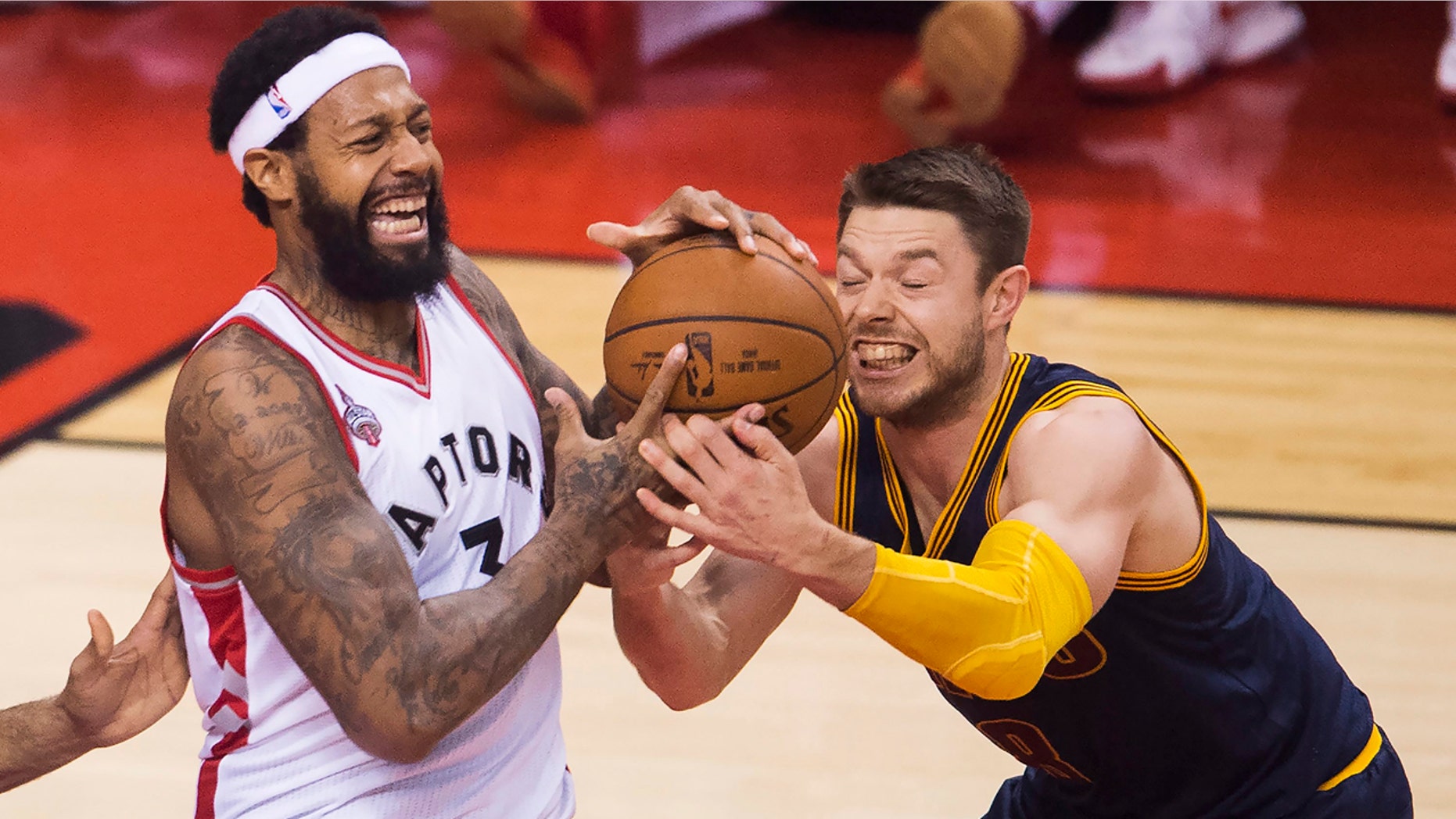 May 23, 2016: Toronto Raptors forward James Johnson (3) battles for the ball against Cleveland Cavaliers guard Matthew Dellavedova (8) during first half Eastern Conference final playoff basketball action in Toronto.