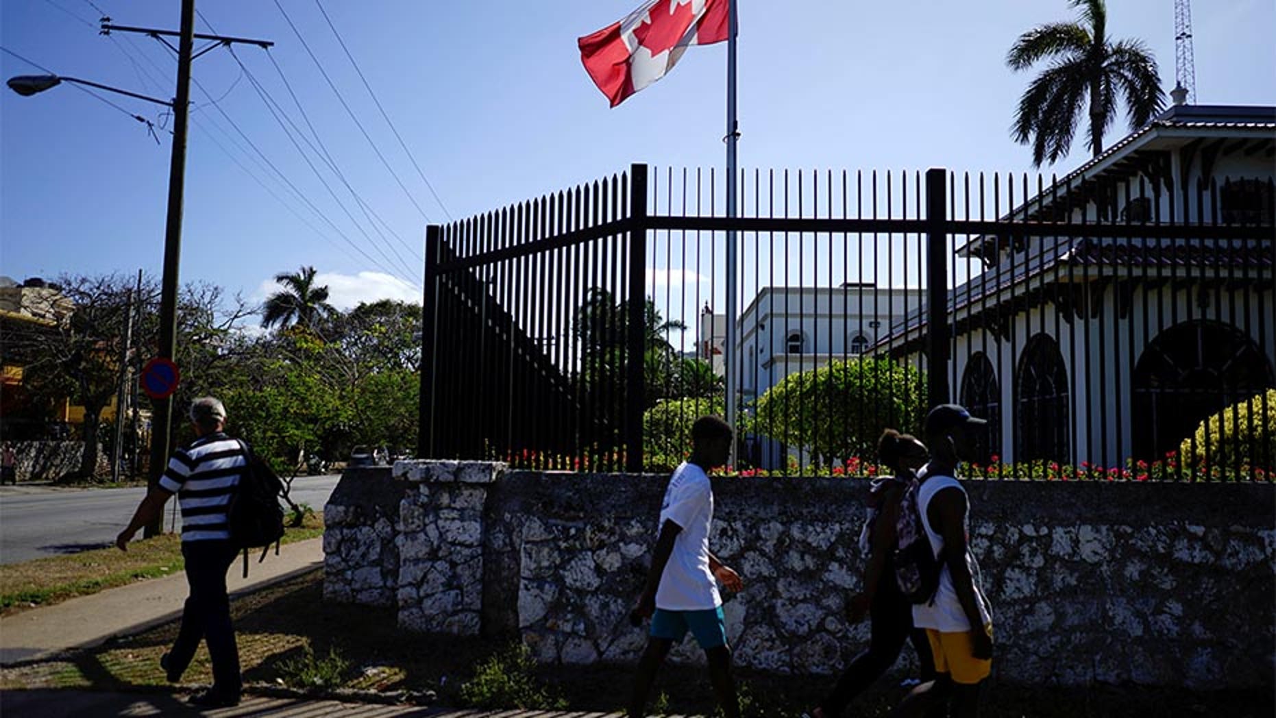 April 16, 2016: People pass by the Canada's Embassy in Havana, Cuba.
