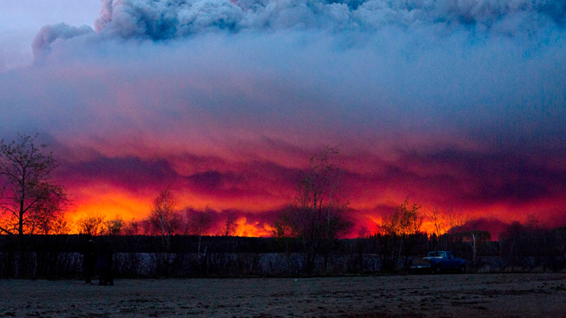 May 4, 2016: A wildfire moves towards the town of Anzac from Fort McMurray, Alberta.