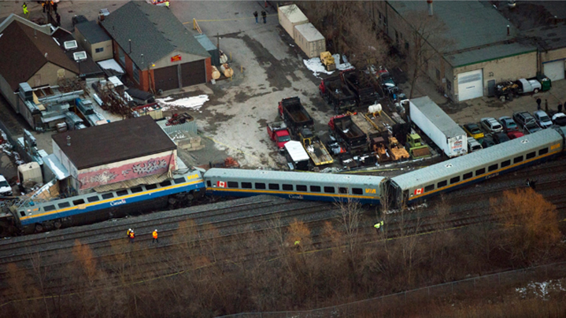 Feb. 26, 2012: Emergency crews work the scene of a Via Rail train derailment in Burlington, Ontario, west of Toronto.