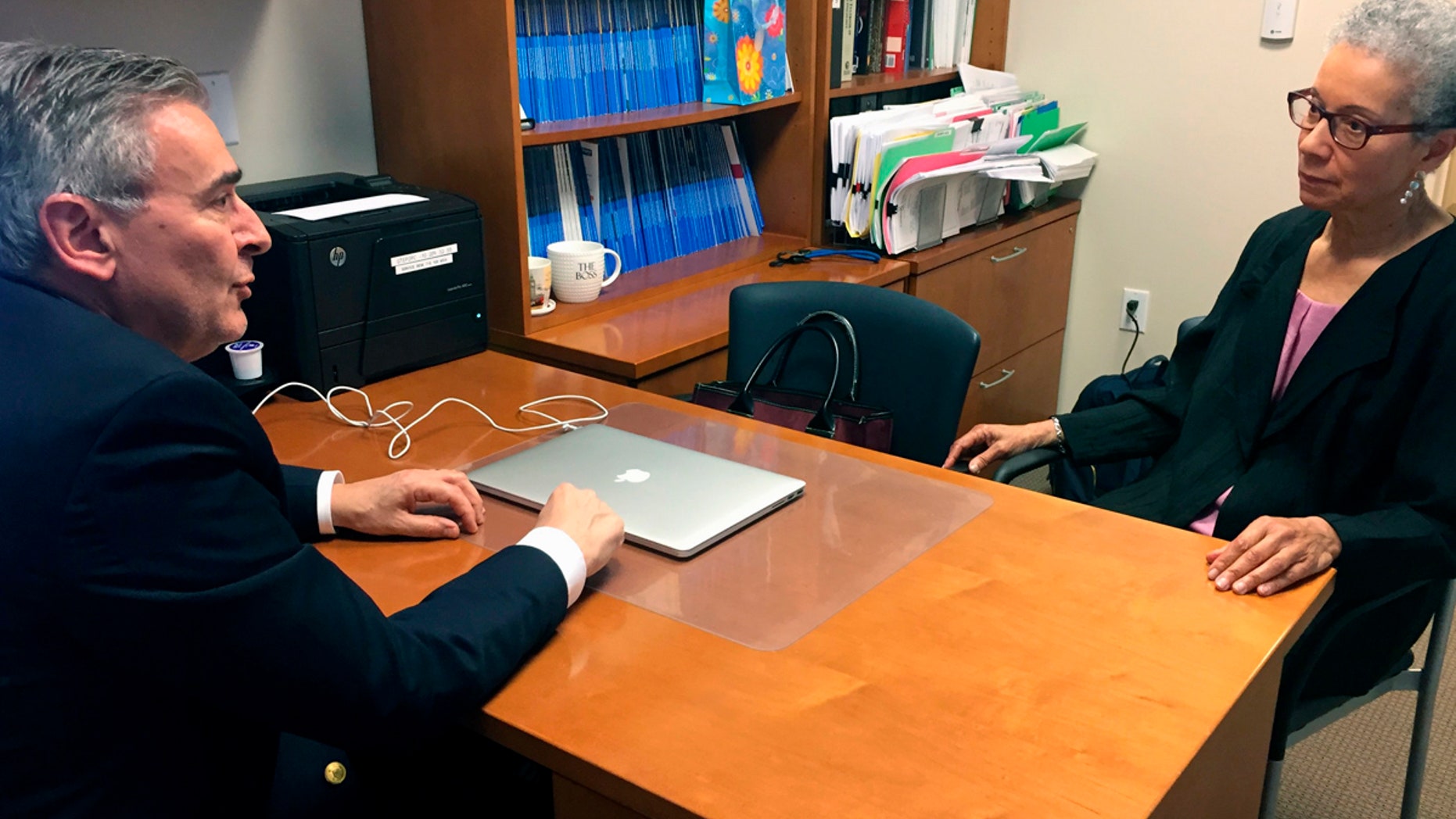 In this Thursday, May 24, 2018 photo, Adine Usher, 78, meets with breast cancer study leader Dr. Joseph Sparano at the Montefiore and Albert Einstein College of Medicine in the Bronx borough of New York.