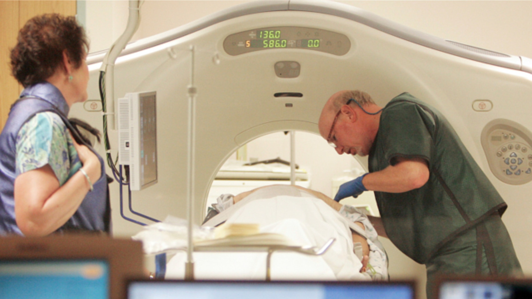 June 3, 2010: Dr. Steven Birnbaum works with a patient in a CT scanner at Southern New Hampshire Medical Center in Nashua, N.H.